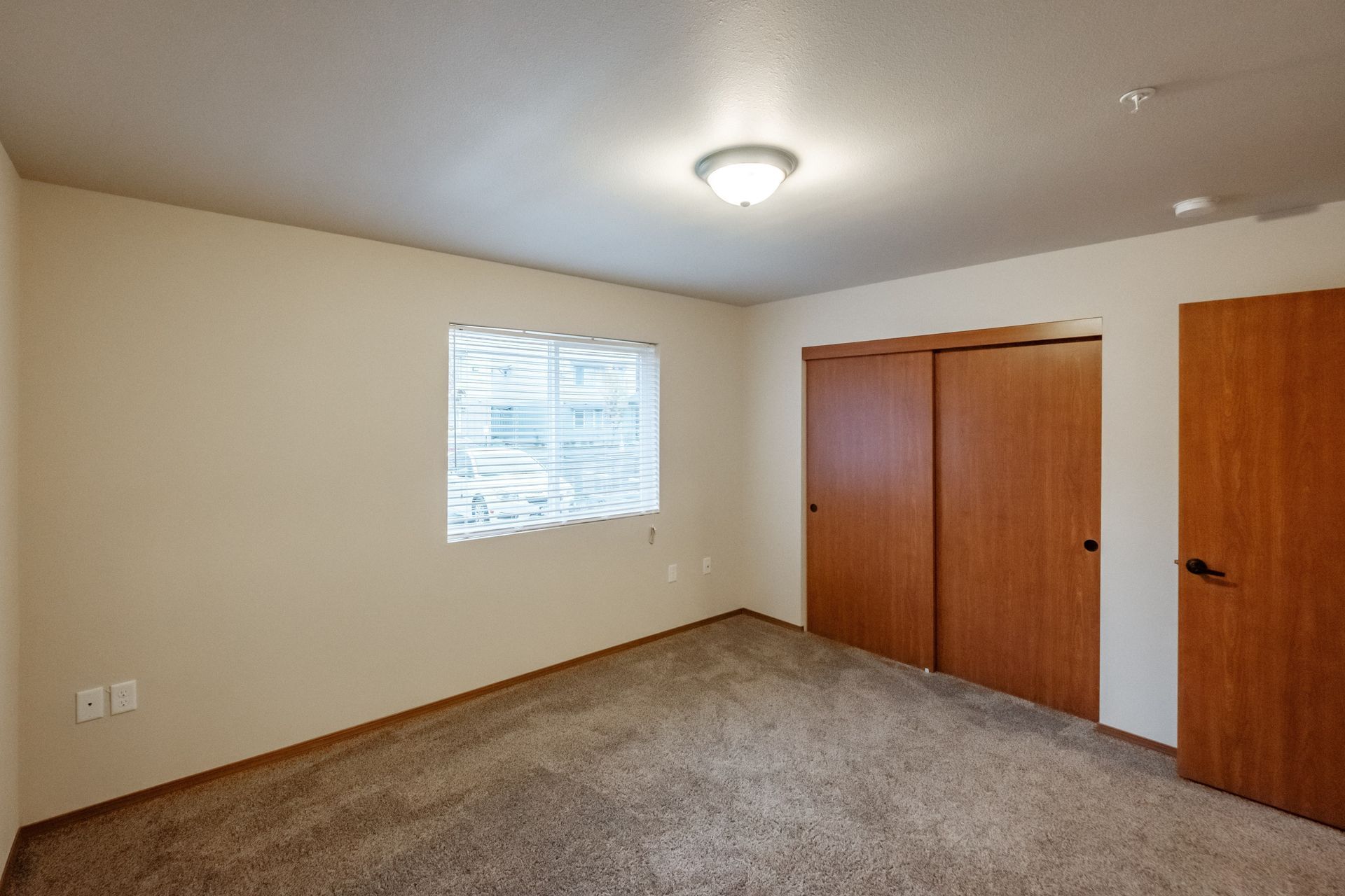 Lafayette Place Apartments in McMinnville, Oregon, near Linfield University – one-bedroom one-bath – bedroom and closets.