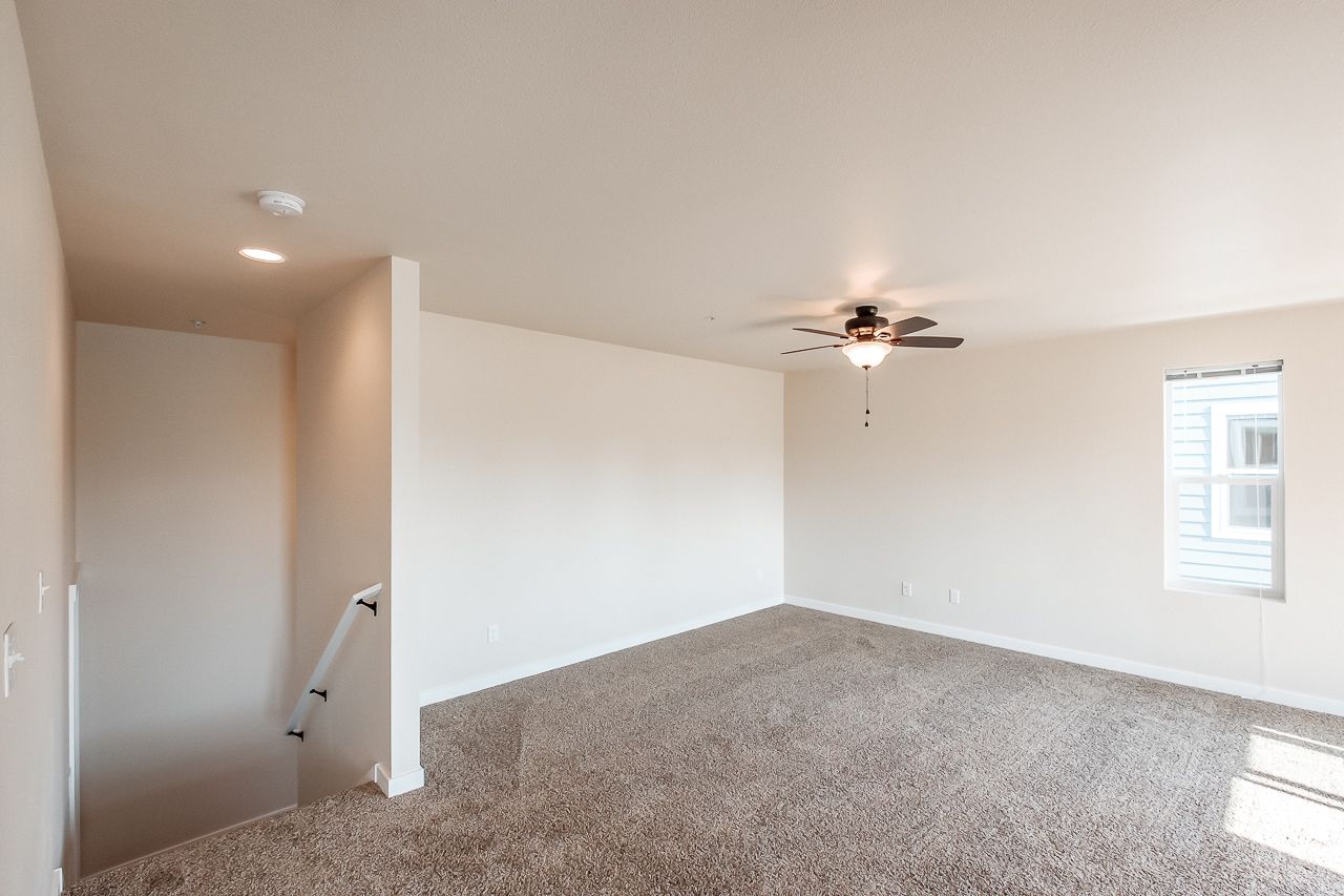 Goodnight Townhomes in Corvallis, OR, Near Oregon State University, four-bed, three-bath – living room and staircase.