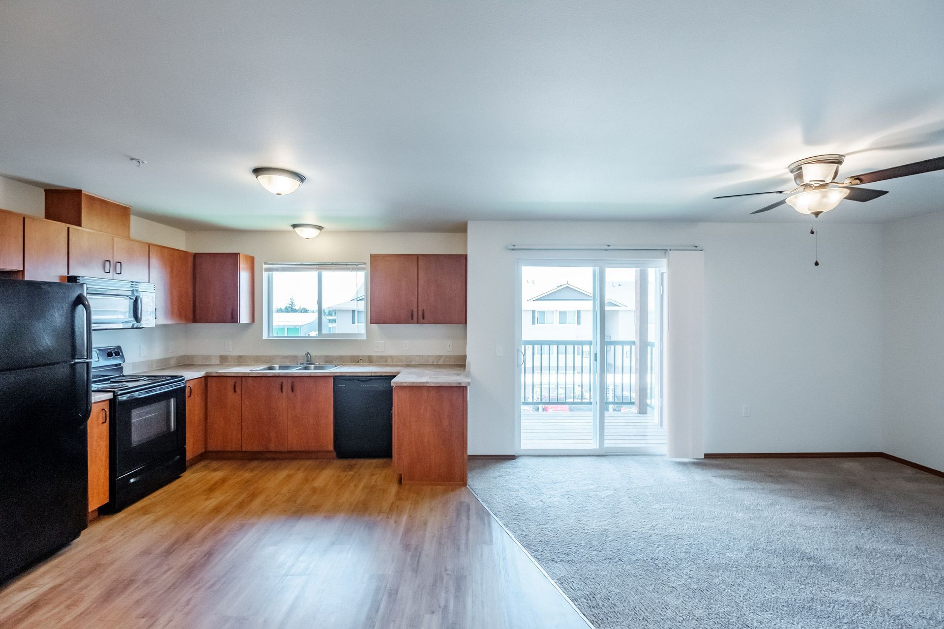 Newcastle Place Apartments in Salem, OR Near Chemeketa Community College, two-bedroom, two-bath – kitchen and glass door view