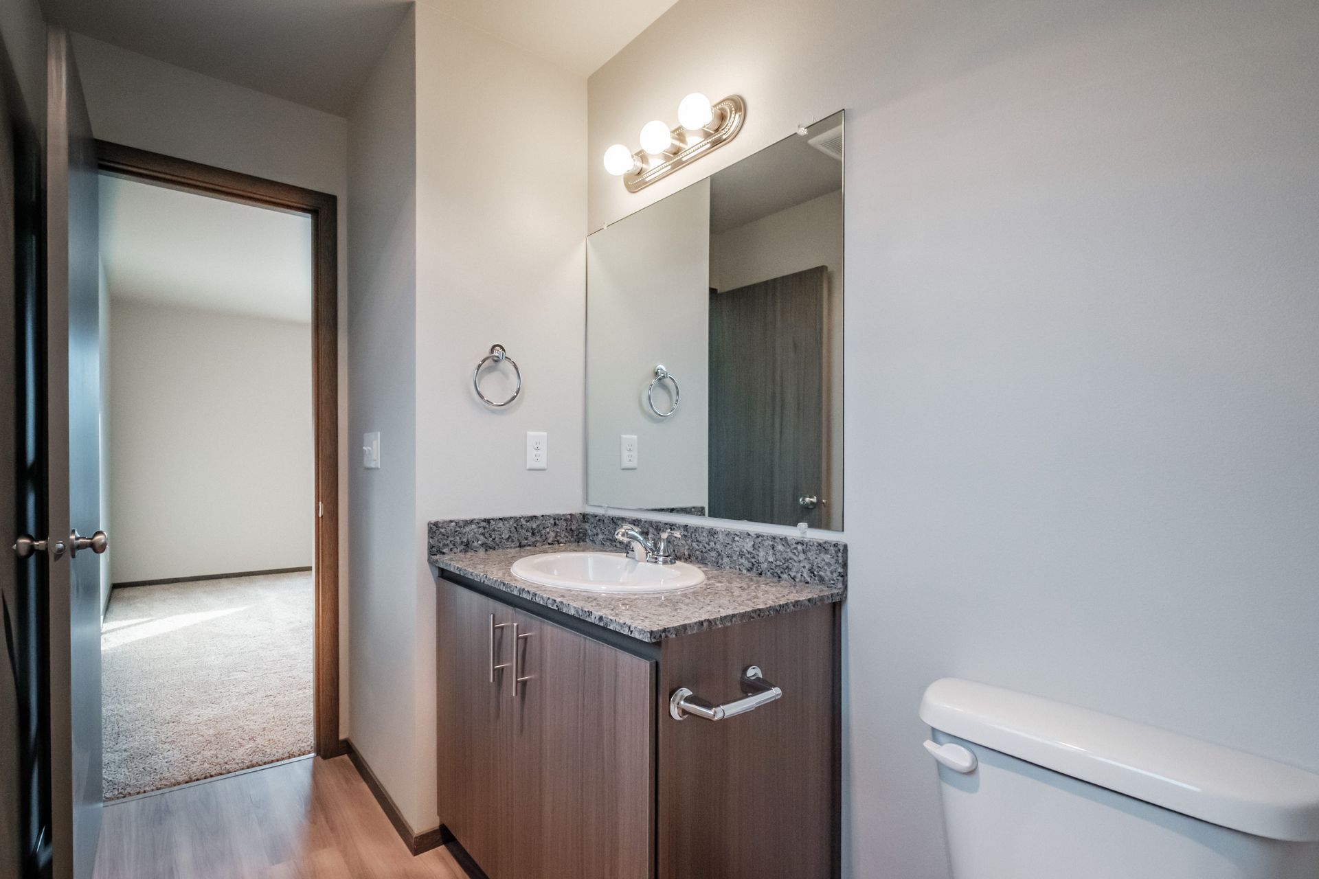 Cherry Glen Apartments in Salem Oregon – two-bedroom two-bathroom apartment home bathroom sink and mirror.