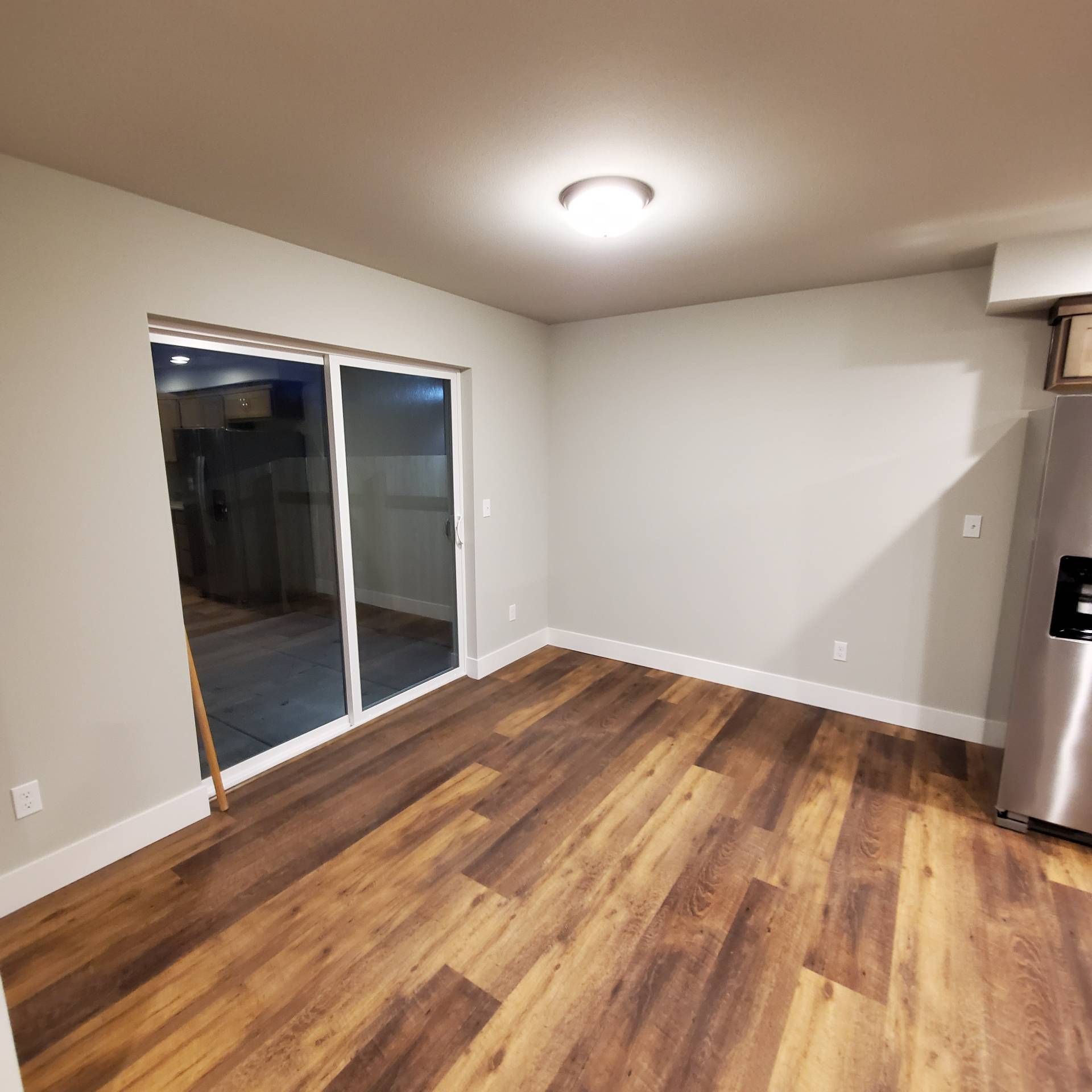 Rye Street Town Homes in Albany, OR. Two Bedroom, Two and 1/2 Bathroom – living room and sliding glass door.