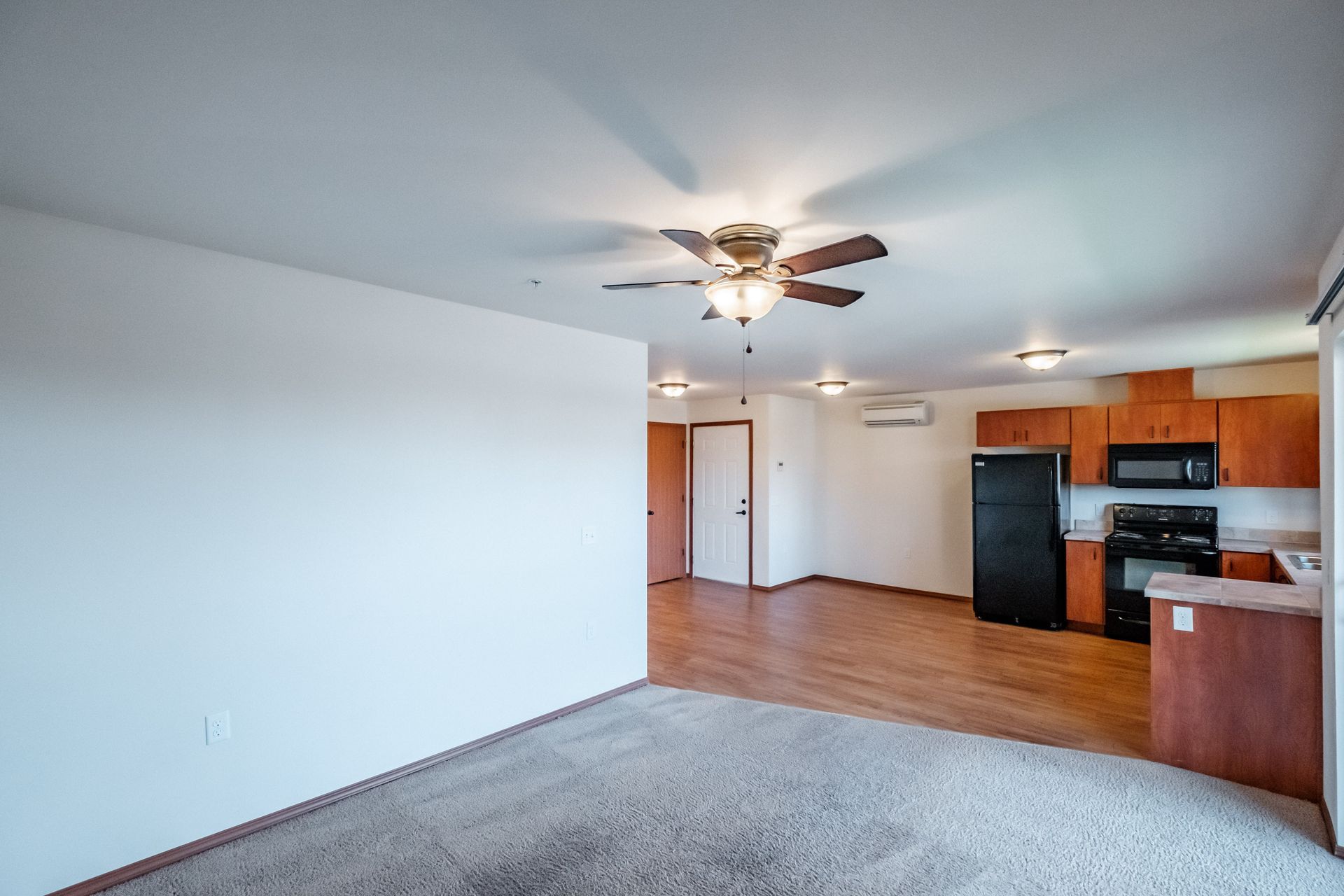 Newcastle Place Apartments in Salem, OR Near Chemeketa Community College, two-bed, two-bath – living room, hallway, kitchen.