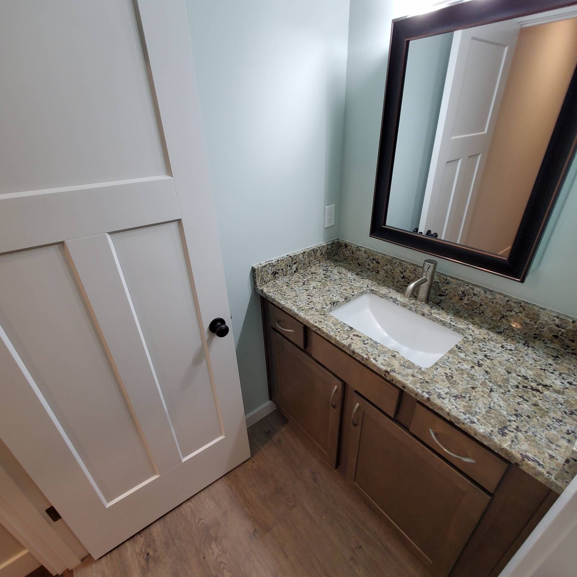 Rye Street Town Homes in Albany, OR. Two Bedroom, Two and 1/2 Bathroom – bathroom sink and mirror -2.