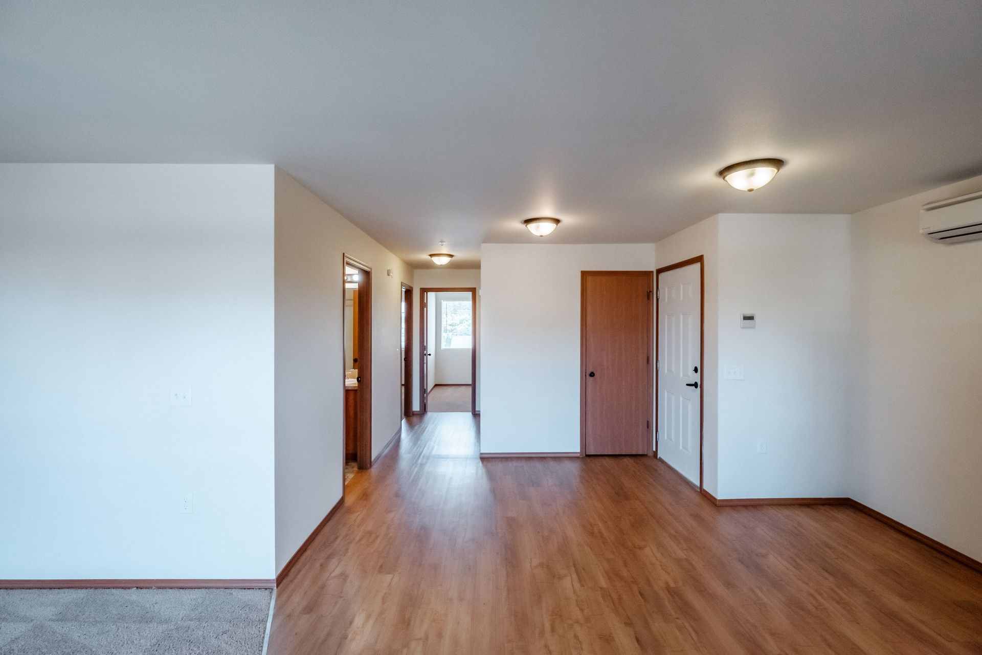 Newcastle Place Apartments in Salem, OR Near Chemeketa Community College, two-bedroom, two-bath – living room to hallway.