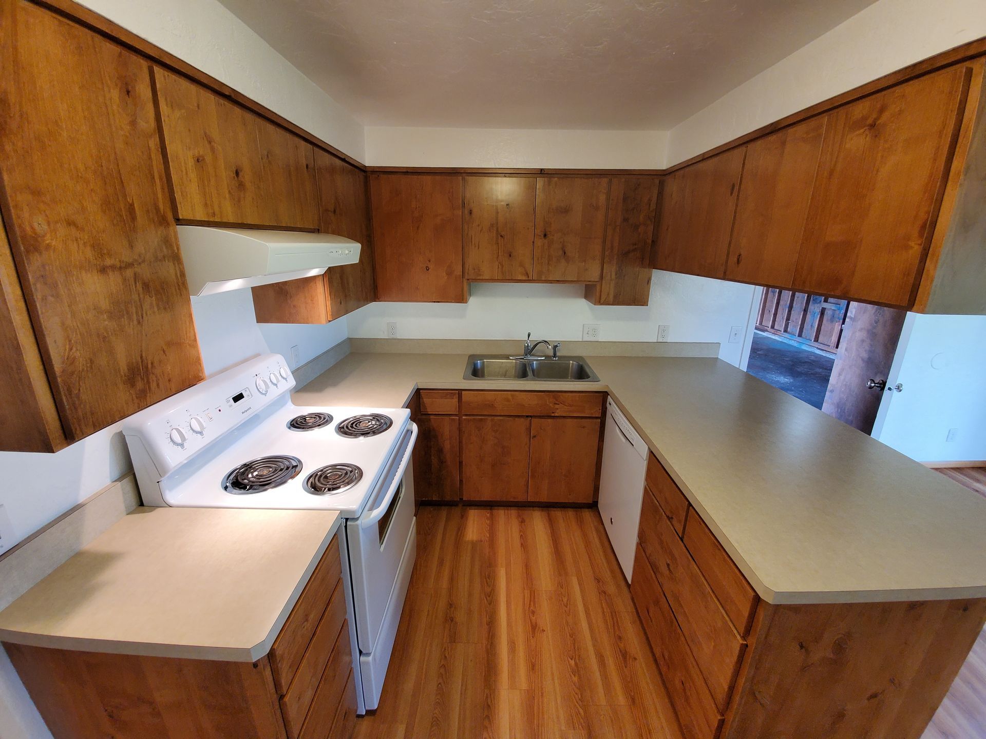 Amanda Lane Duplexes in Millersburg Oregon, three-bedroom two-bathroom – kitchen sink stove and cabinets.