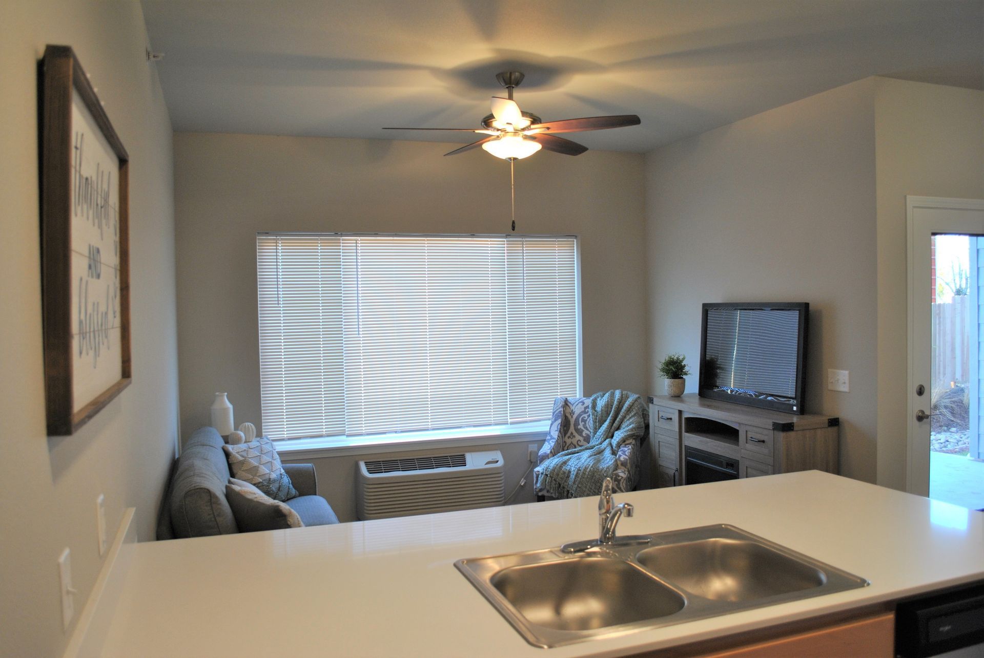 Pleasant View Apartments in Keizer Oregon, two-bedroom two-bathroom – kitchen sink and living room.