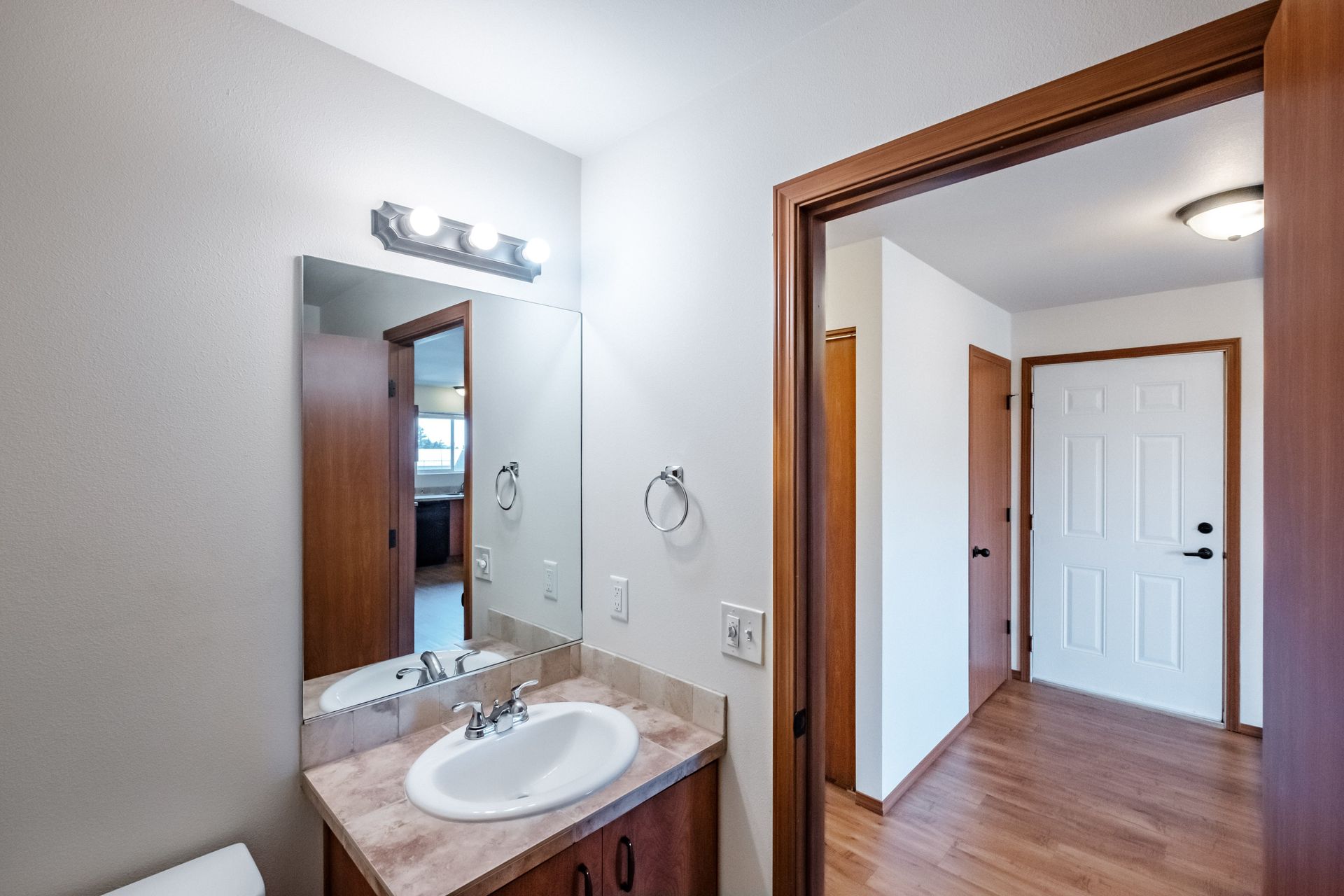 Newcastle Place Apartments in Salem, OR Near Chemeketa Community College, two-bedroom, two-bath – bathroom sink, mirror.