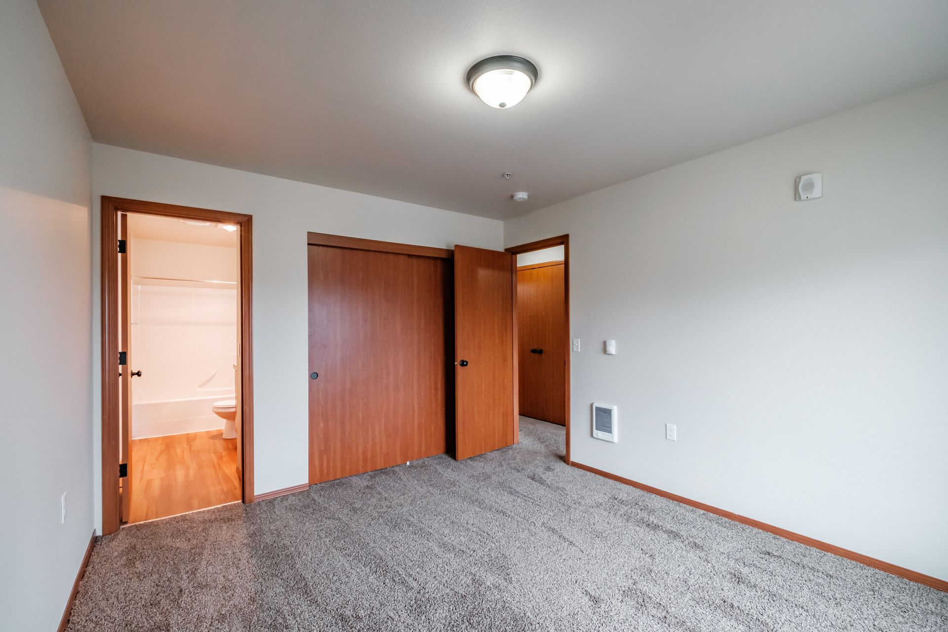 Aspen Place Apartments in Lebanon OR, near Western University of Health Sciences, two-bed two-bath –bedroom, bathroom, door.