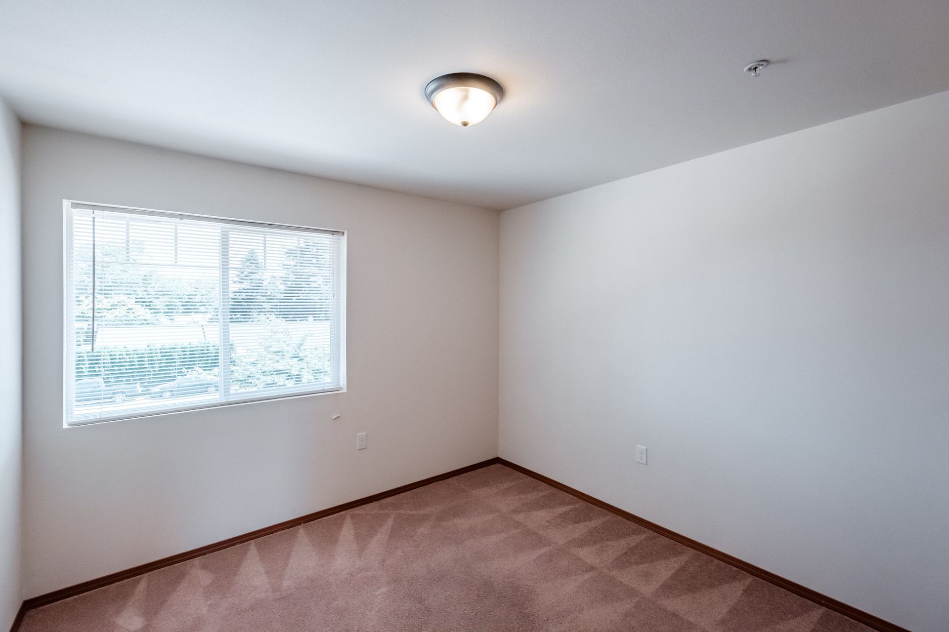 Newcastle Place Apartments in Salem, OR Near Chemeketa Community College, two-bedroom, two-bath – bedroom window -2.