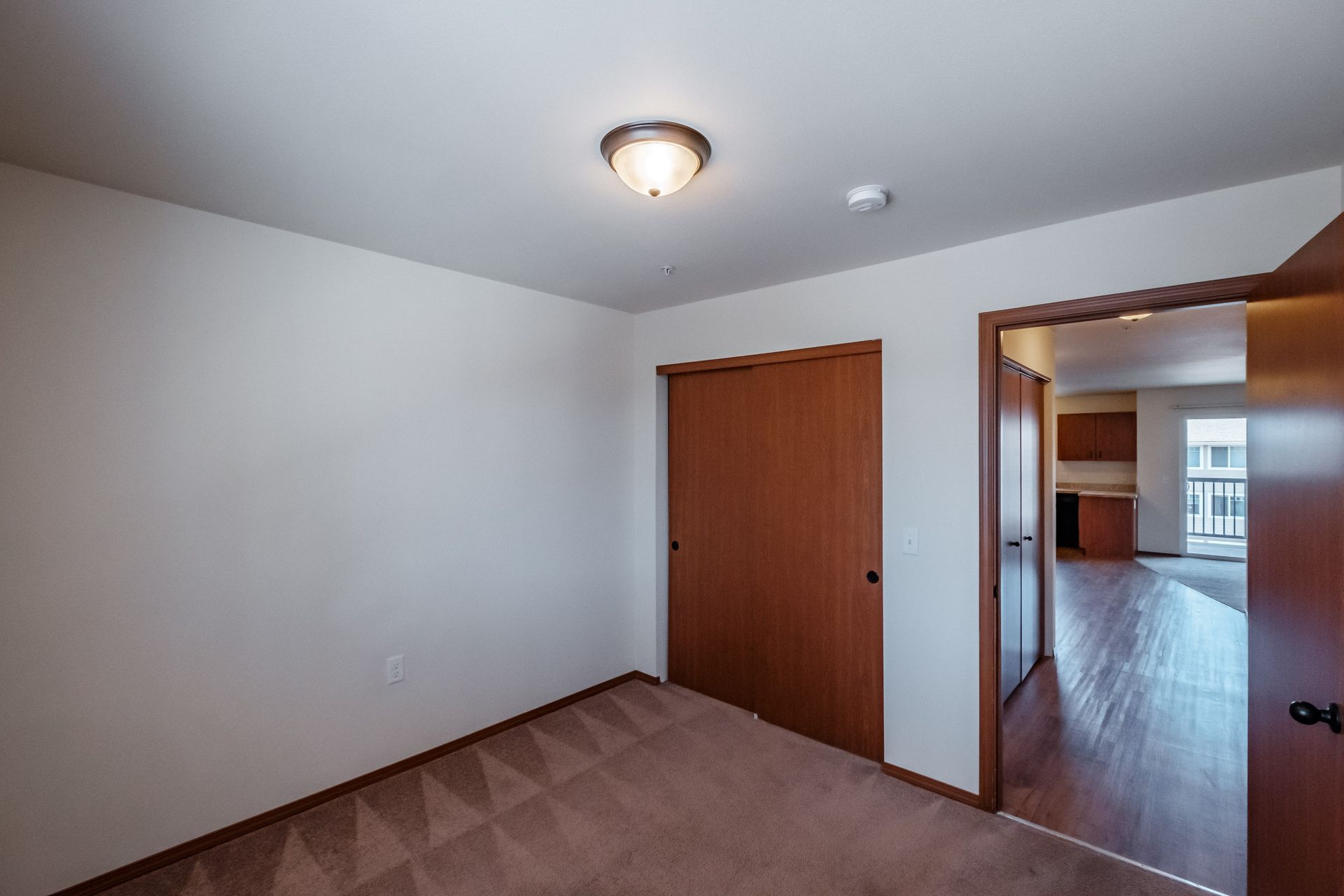 Newcastle Place Apartments in Salem, OR Near Chemeketa Community College, two-bedroom, two-bath–bedroom and closet.