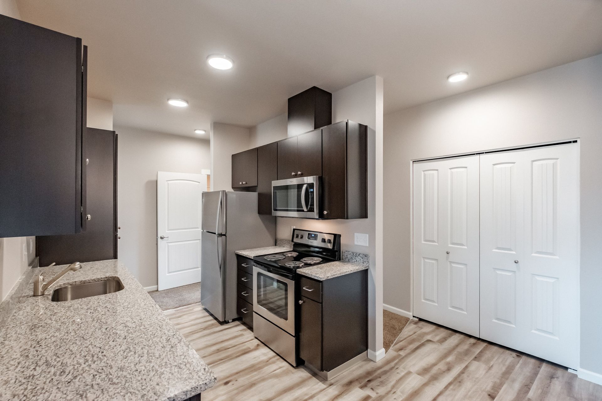 Hickory Hollow Apartments in North Albany OR, three-bedroom two-bathroom –kitchen, hallway.