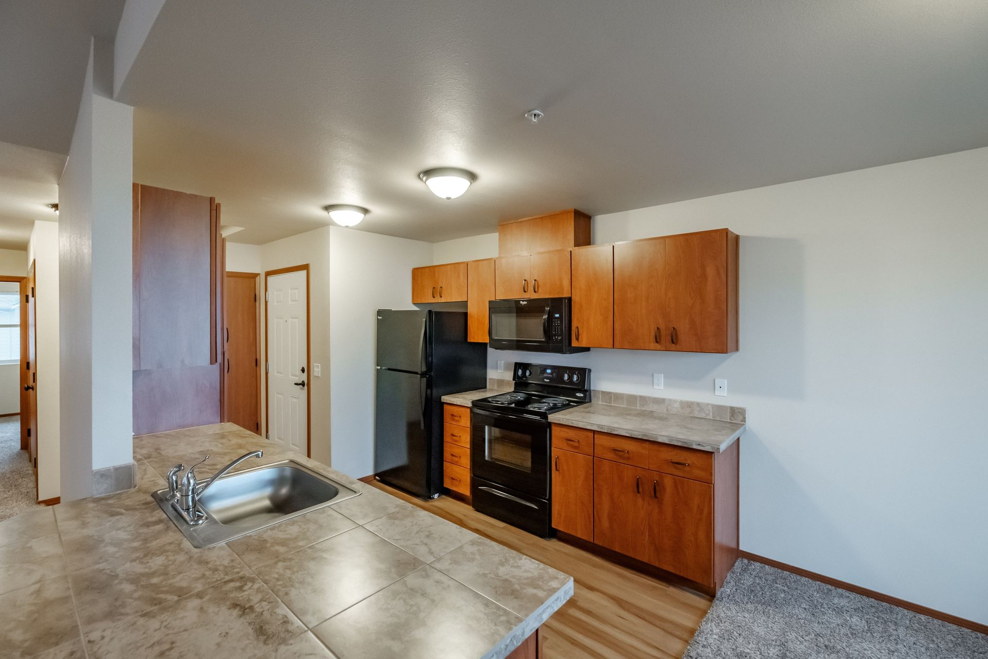 Lafayette Place Apartments in McMinnville, Oregon, near Linfield University – two-bedroom two-bath – kitchen with sink.