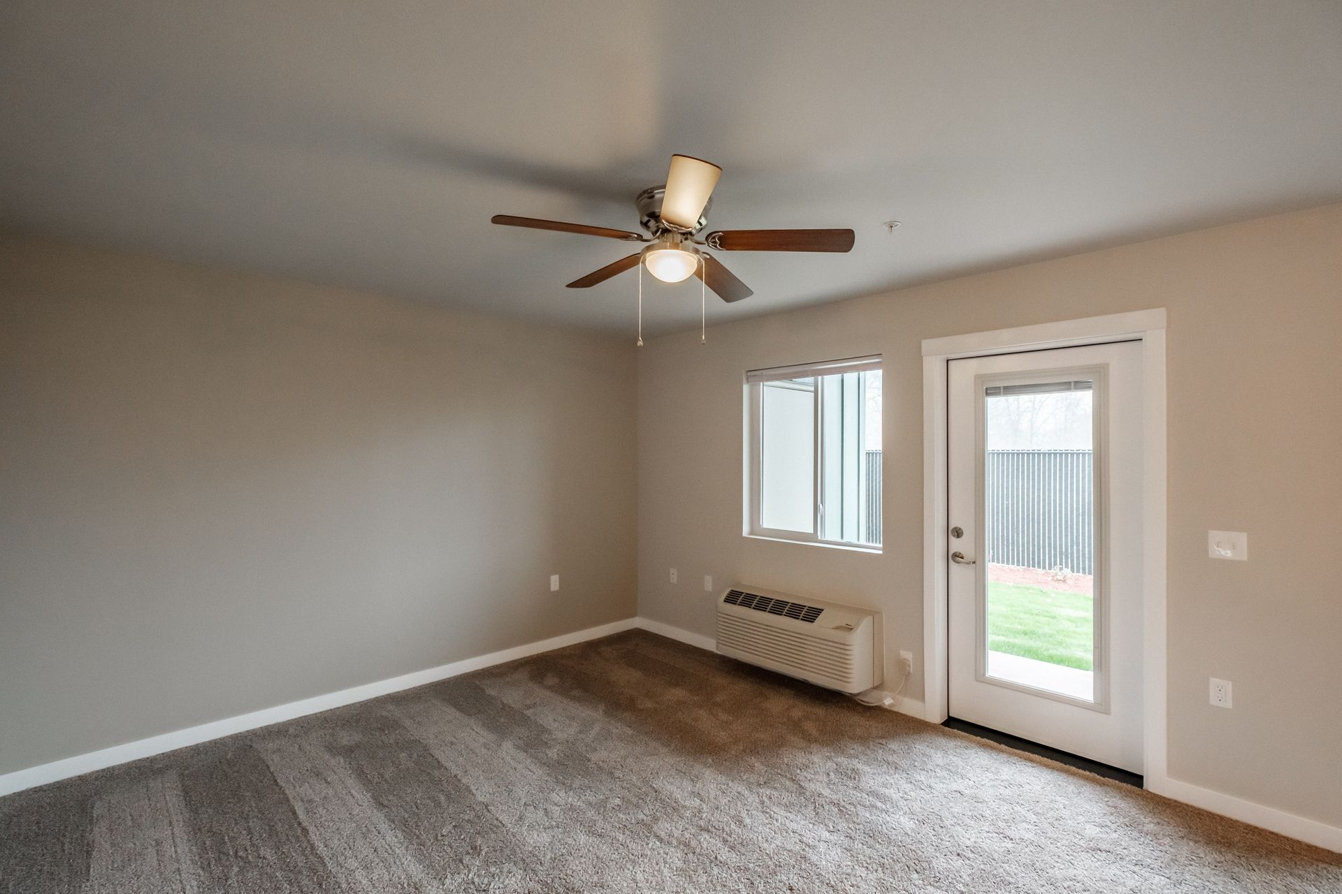 Evergreen Valley Apartments in McMinnville Oregon, two-bedroom two-bathroom – heater, AC, sliding glass door.