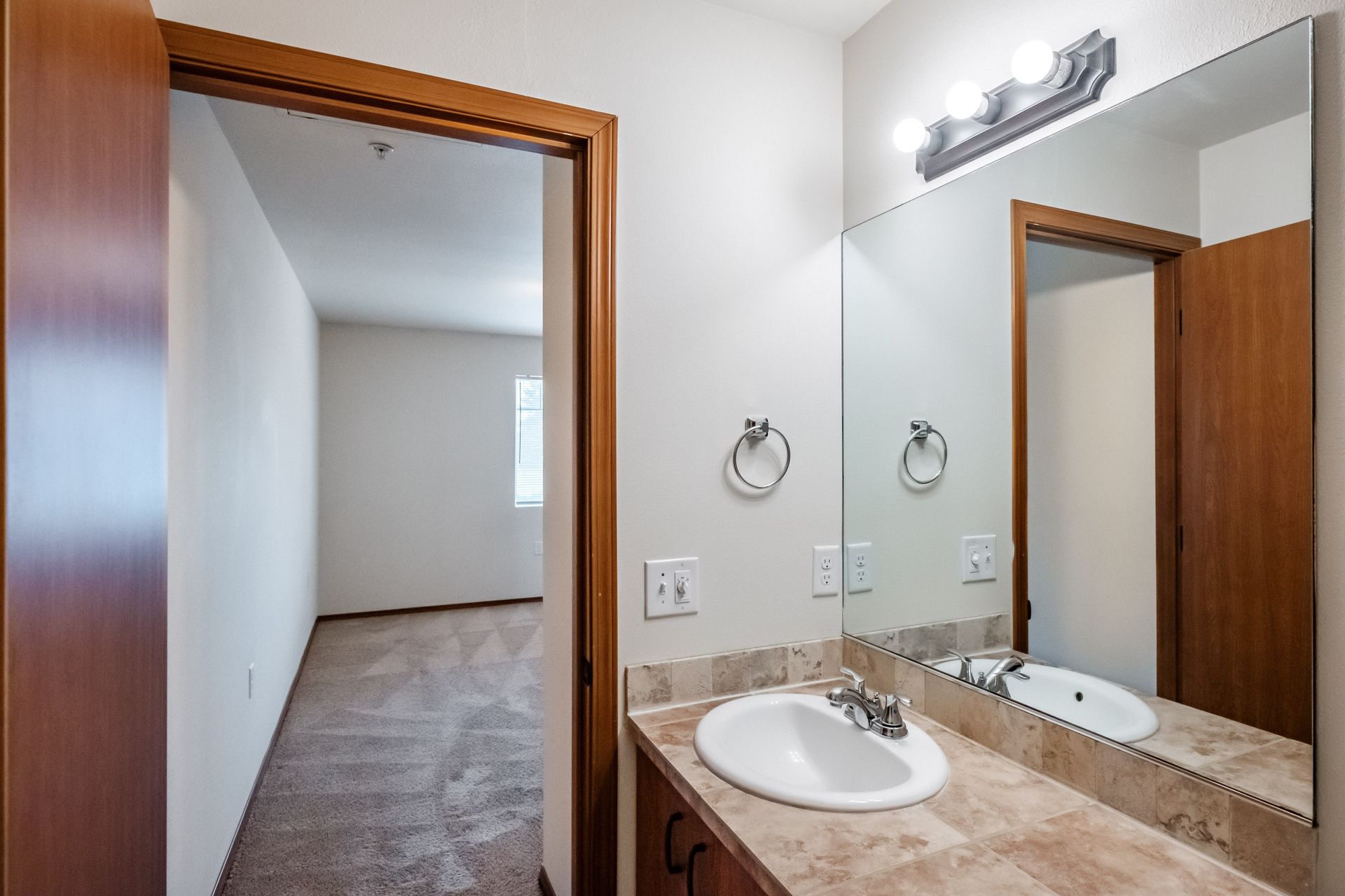 Newcastle Place Apartments in Salem, OR Near Chemeketa Community College, two-bedroom, two-bath– master bathroom sink, mirror