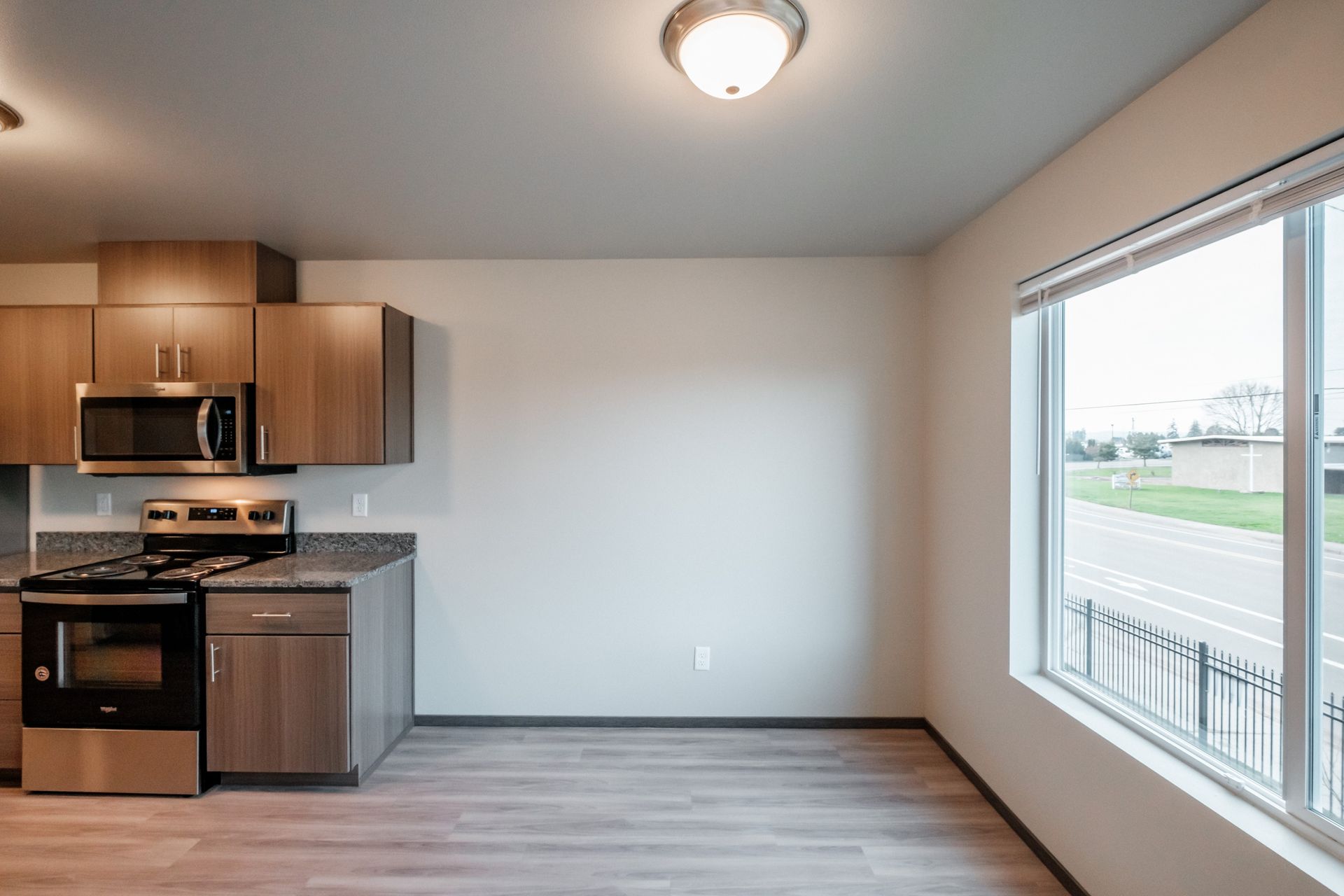 Cherry Glen Apartments in Salem Oregon – two-bedroom two-bathroom apartment home living room and partial kitchen.