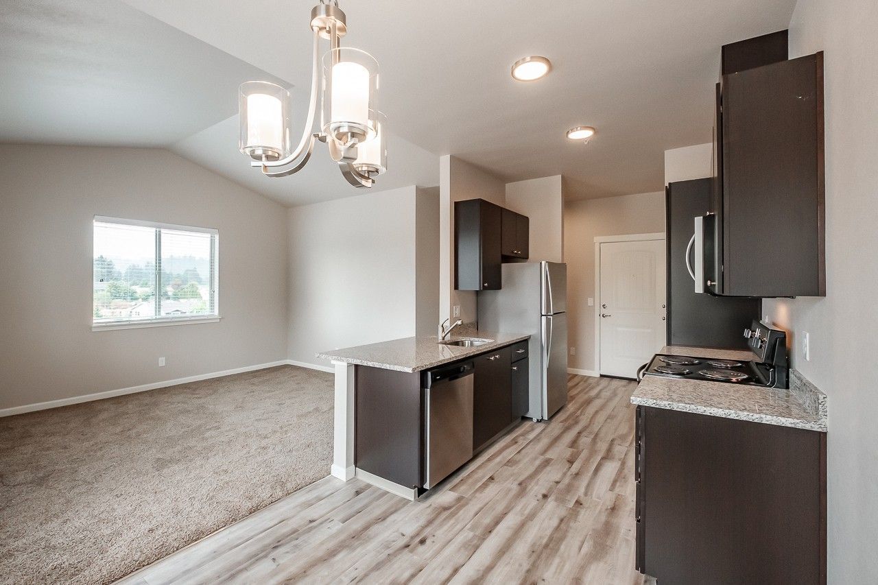 Hickory Hollow Apartments in North Albany OR, one-bedroom one-bathroom – kitchen, dishwasher, refrigerator, living room.