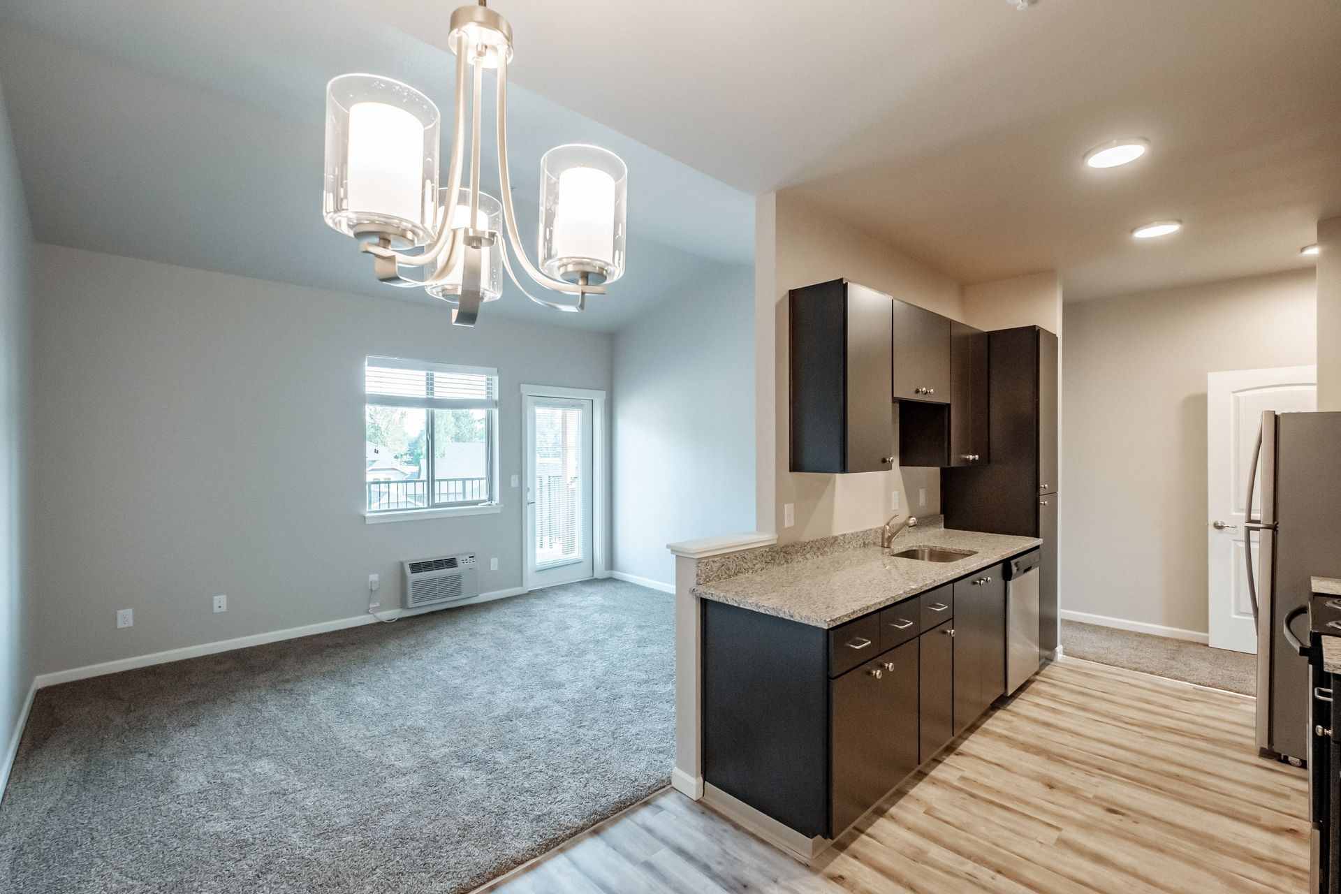 Hickory Hollow Apartments in North Albany OR, three-bedroom two-bathroom –kitchen and living room.