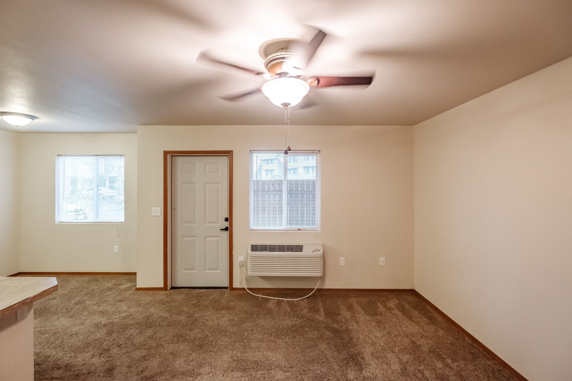 Lafayette Place Apartments in McMinnville, Oregon, near Linfield University – one-bedroom one-bath – living room, back door.