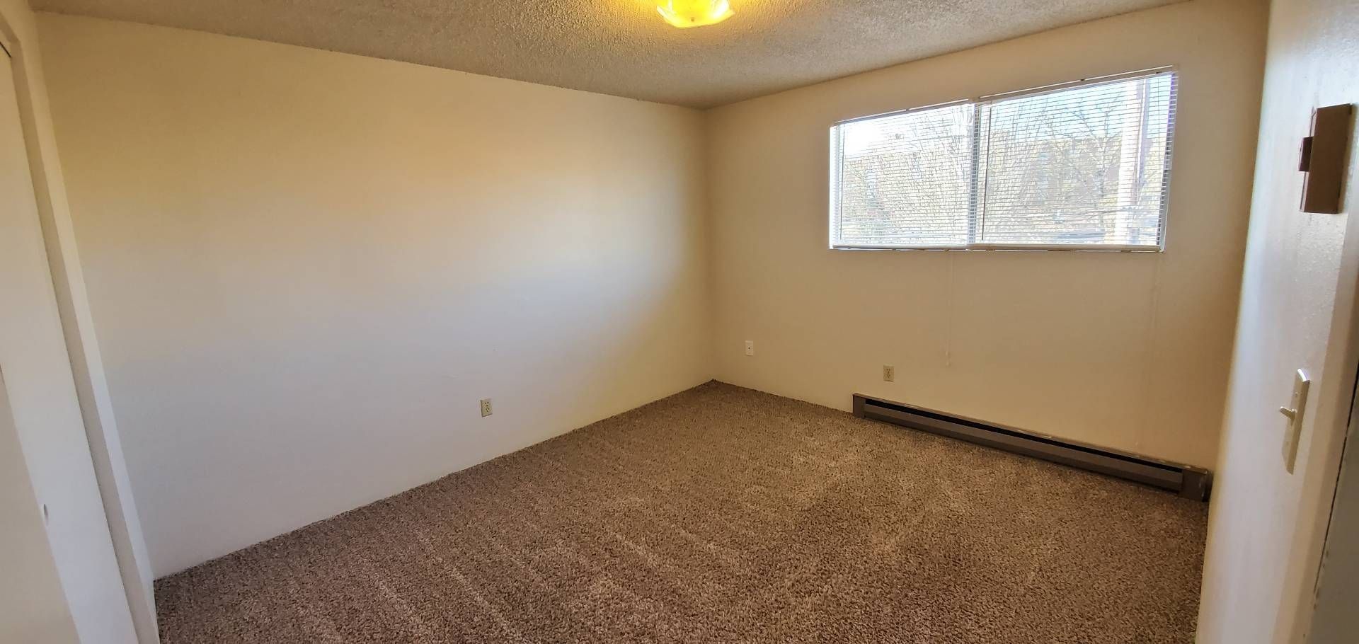 1061 Washington Apartments in Corvallis OR, Near Oregon State University, two-bedroom two-bathroom – living room and heater.