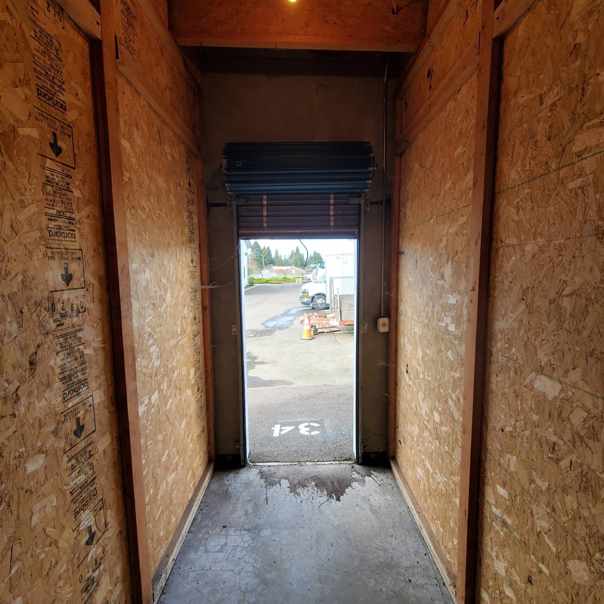 34 Self Store in Tangent Oregon, near Oregon State University – small storage unit looking out through metal doorframe