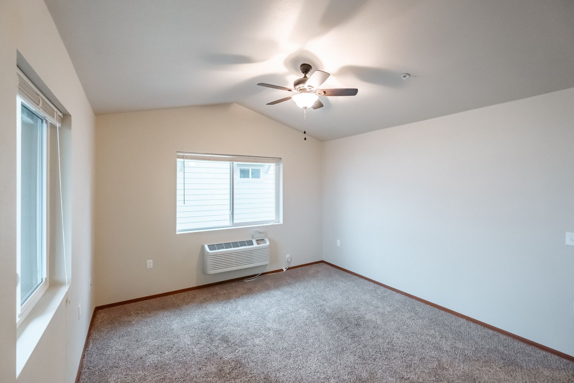 Lafayette Place Apartments in McMinnville, Oregon, near Linfield University – two-bedroom two-bath – living room, heater, AC.