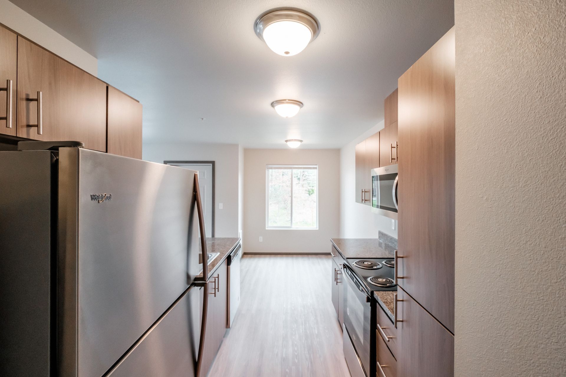 Cherry Glen Apartments in Salem Oregon – one bedroom one bathroom apartment home refrigerator in kitchen.