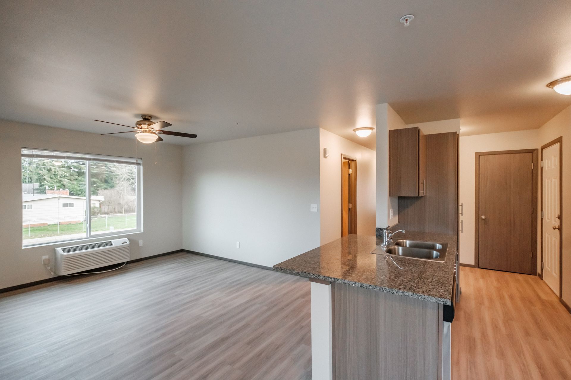 Cherry Glen Apartments in Salem Oregon – two-bedroom two-bathroom apartment home kitchen and living room.