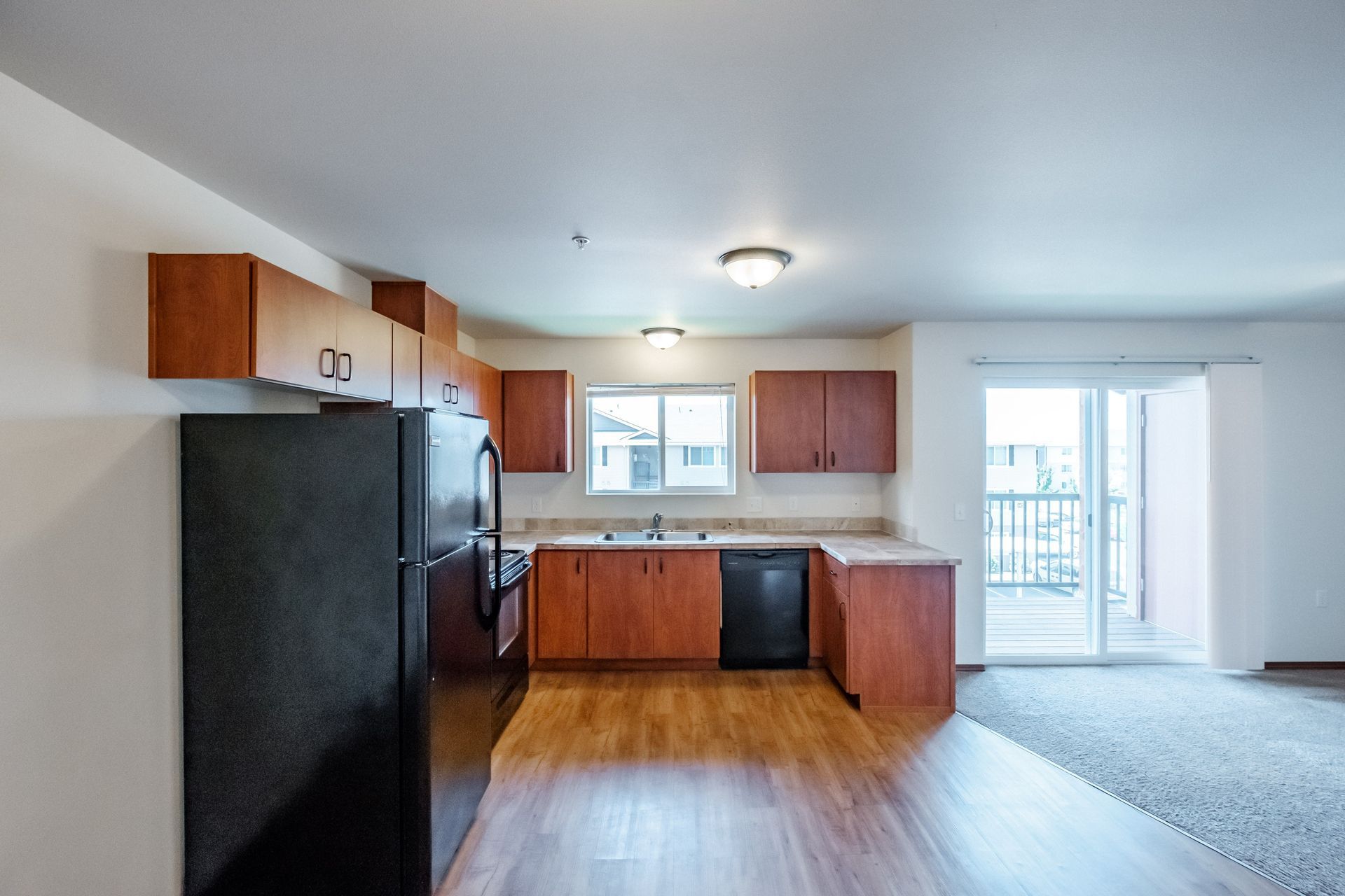 Newcastle Place Apartments in Salem, OR Near Chemeketa Community College, two-bedroom, two-bath – kitchen far out.