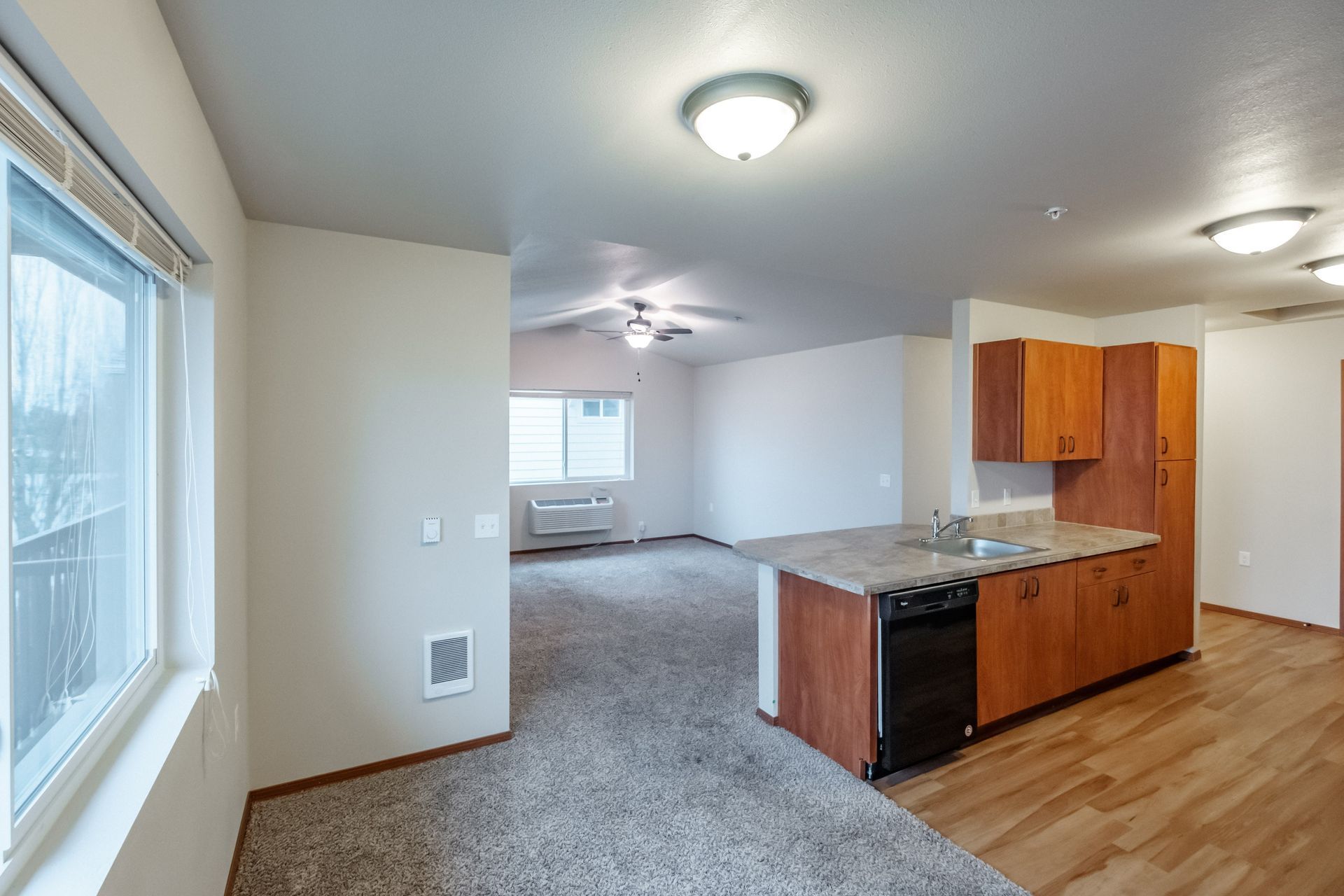 Lafayette Place Apartments in McMinnville, Oregon, near Linfield University – two-bedroom two-bath – kitchen to living room.