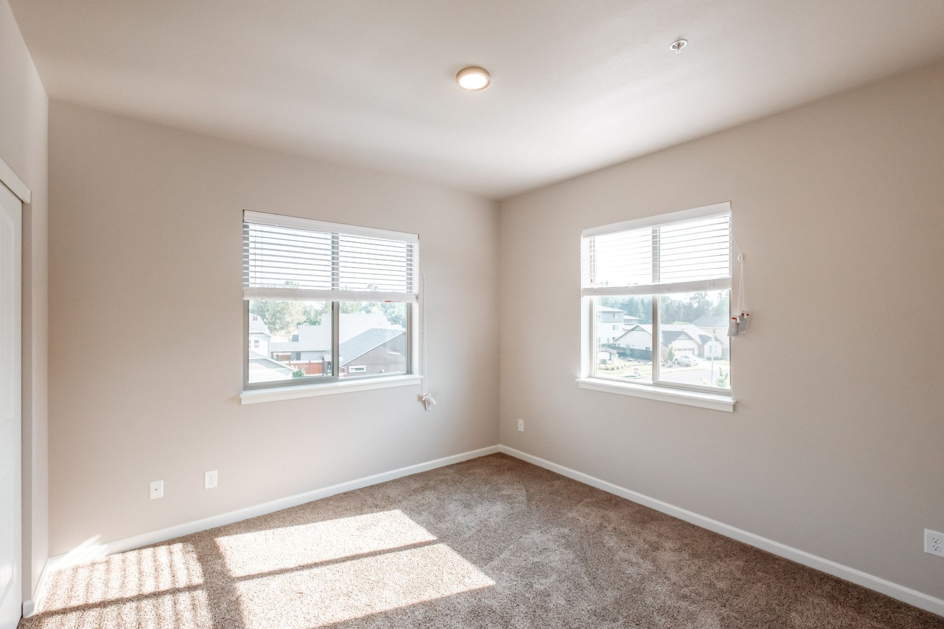 Hickory Hollow Apartments in North Albany OR, three-bedroom two-bathroom – master bedroom windows -1.