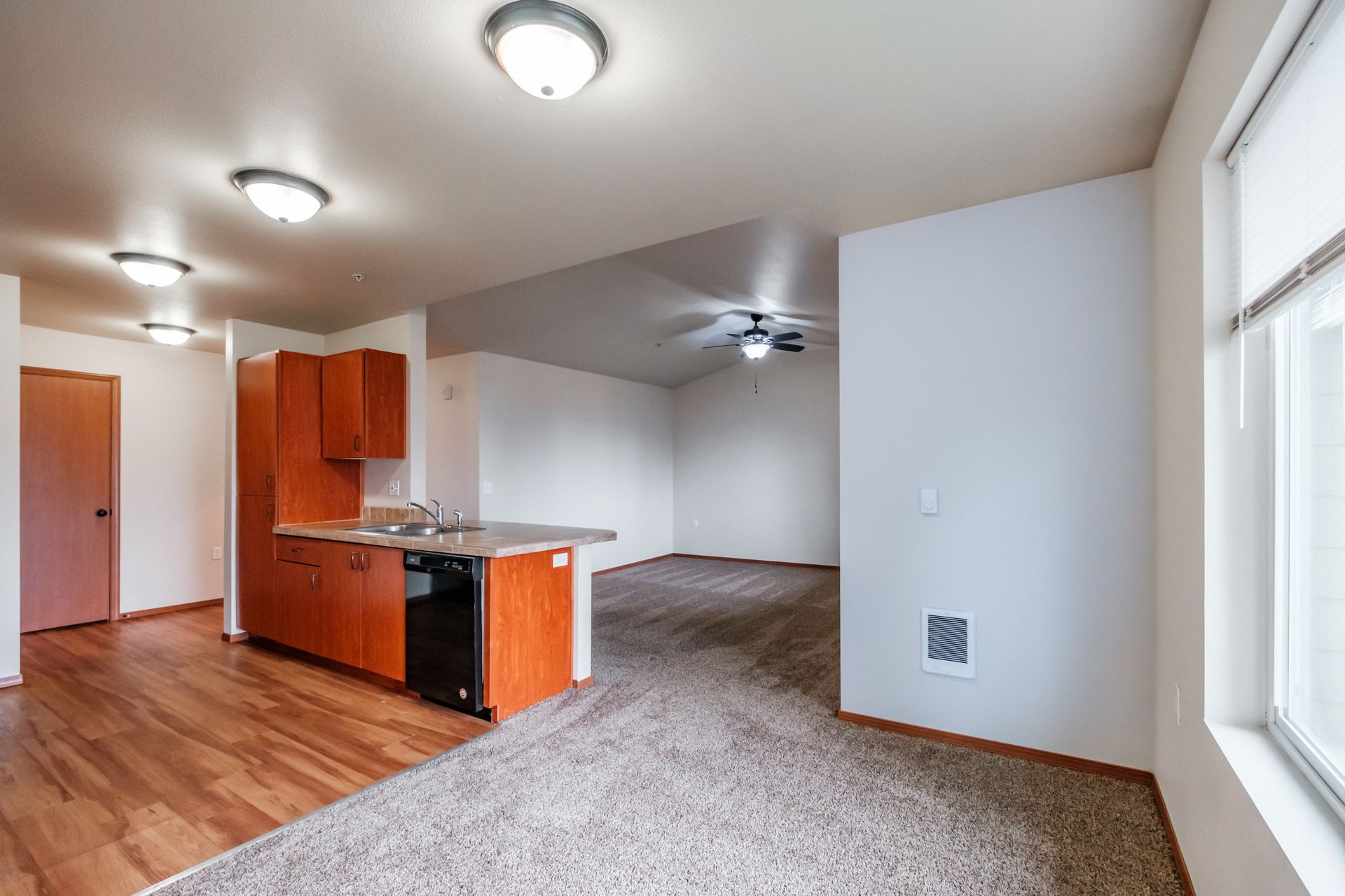 Aspen Place Apartments, near Western University of Health Sciences, two-bed two-bath – kitchen, living room, dining room.