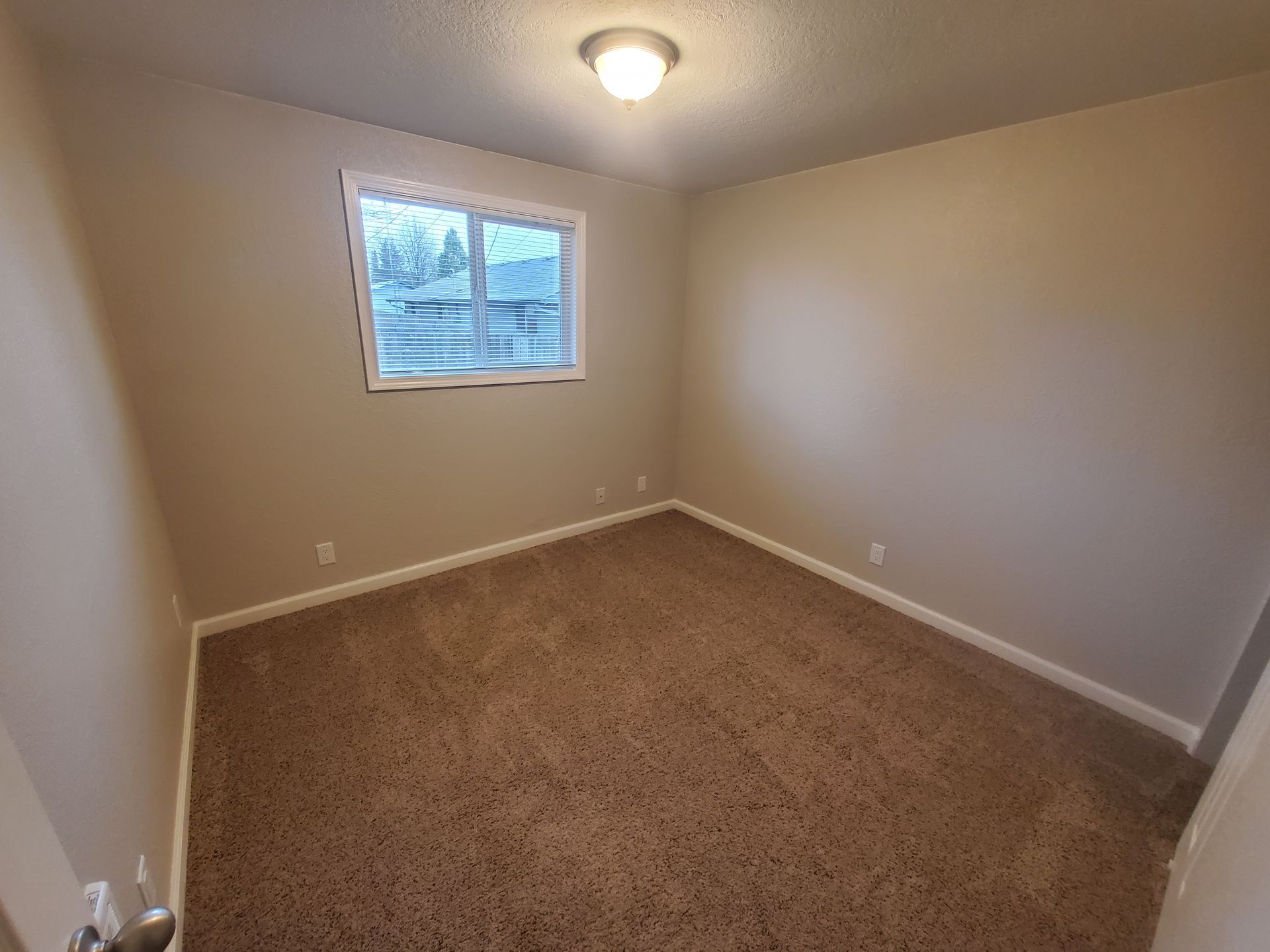 Jackson Duplexes in Albany Oregon – two bedroom one-bathroom – bedroom and window – 1. 