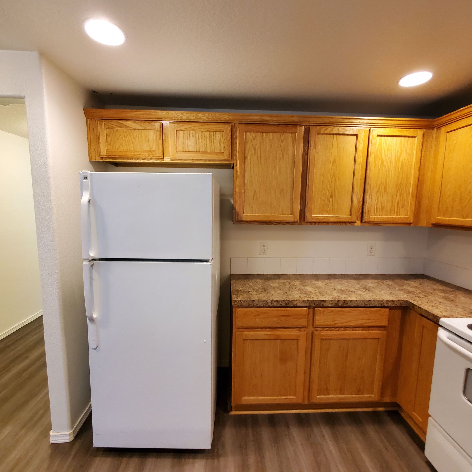 Meadowridge Townhomes in Monmouth Oregon, near Western Oregon University – wooden kitchen cabinets and refrigerator.