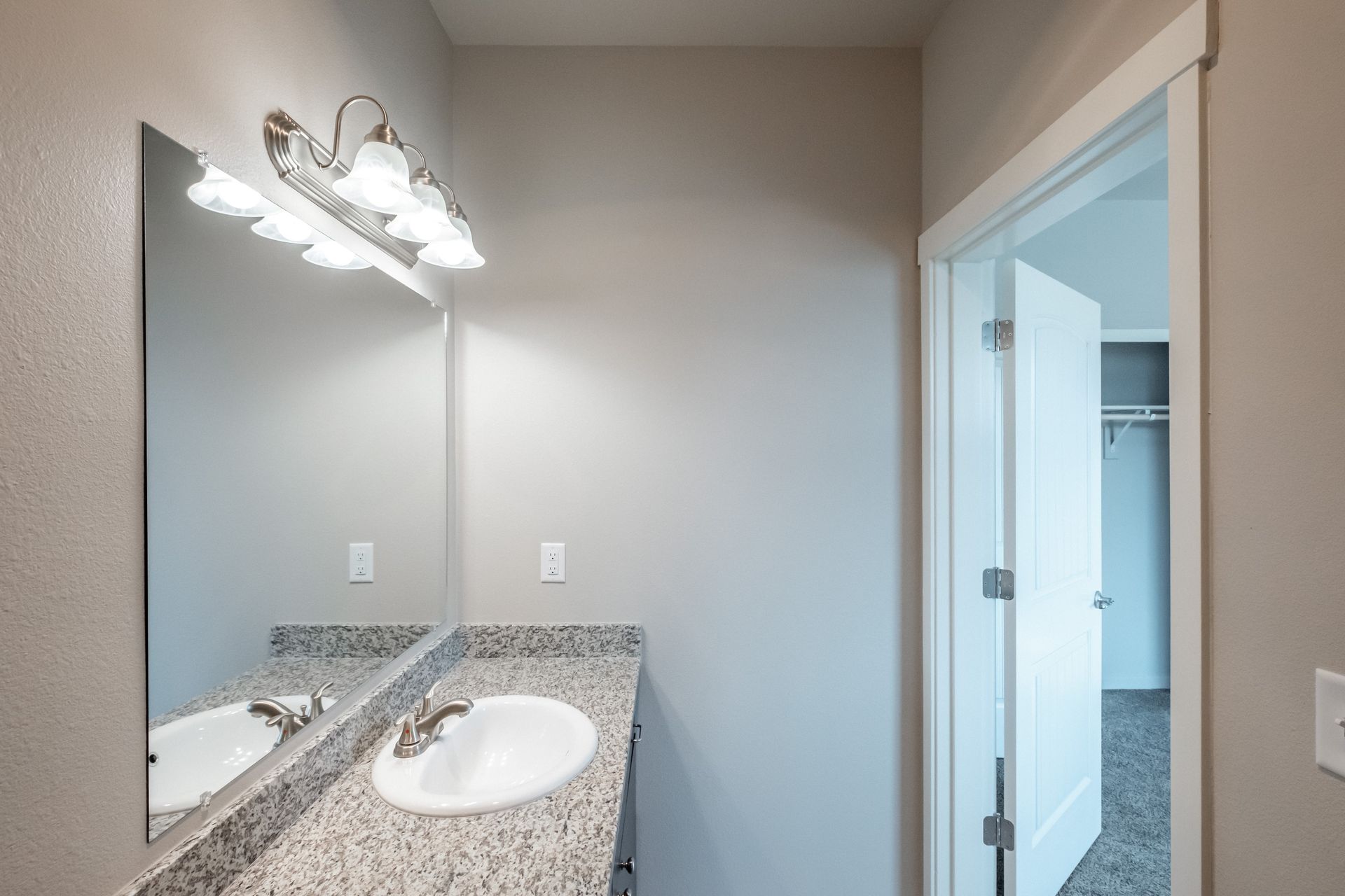 Hickory Hollow Apartments in North Albany OR, three-bedroom two-bathroom – master bathroom sink and mirror –1.