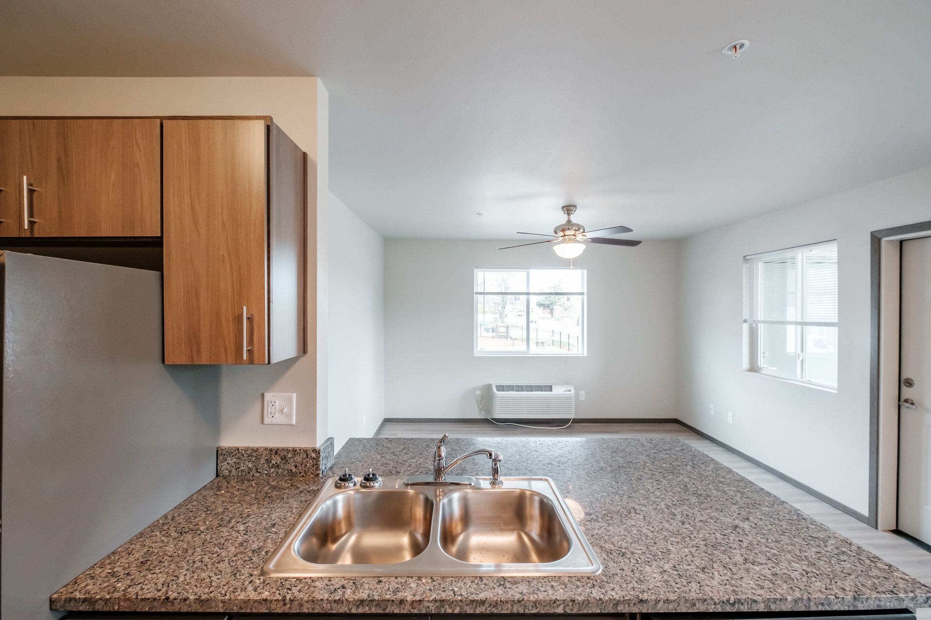 Cherry Glen Apartments in Salem Oregon – one bedroom one bathroom apartment home kitchen sink and living room.