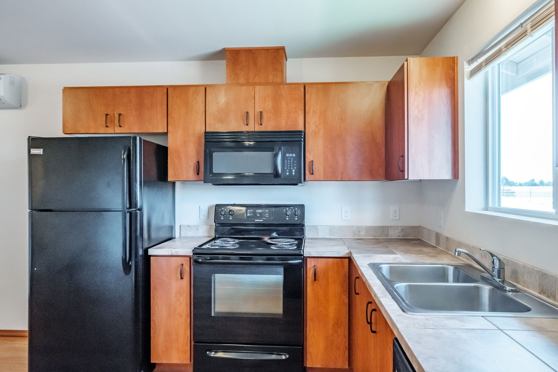 Newcastle Place Apartments in Salem, OR Near Chemeketa Community College, two-bedroom, two-bath – kitchen cabinets.