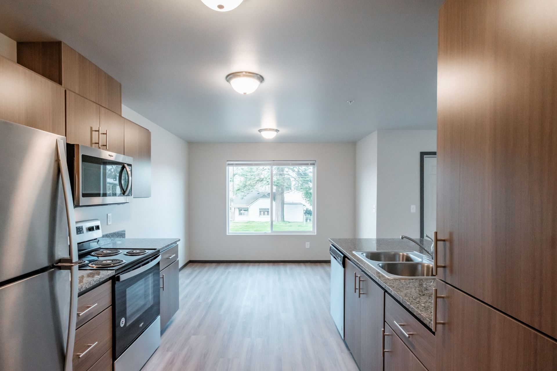 Cherry Glen Apartments in Salem Oregon – two bedroom two bathroom apartment home kitchen and kitchen window.