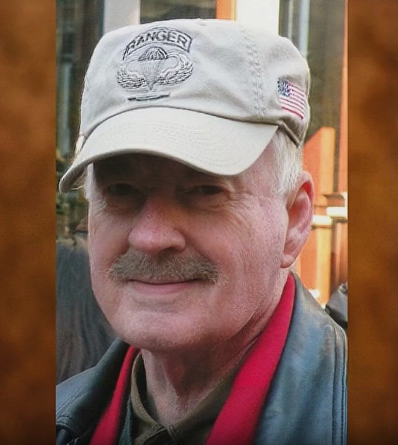 Man with mustache wearing a 