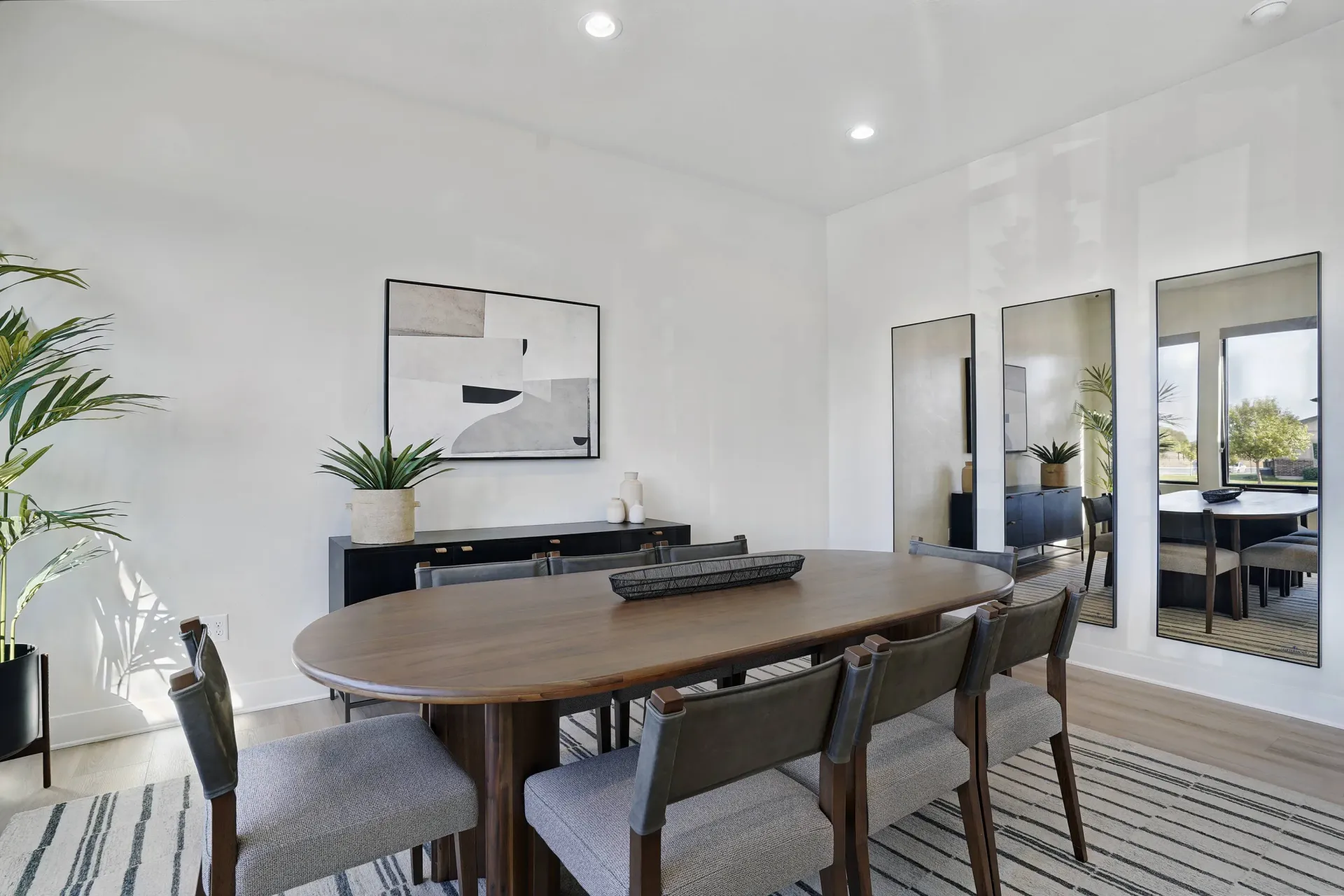 Apartment dining room with table and chairs.