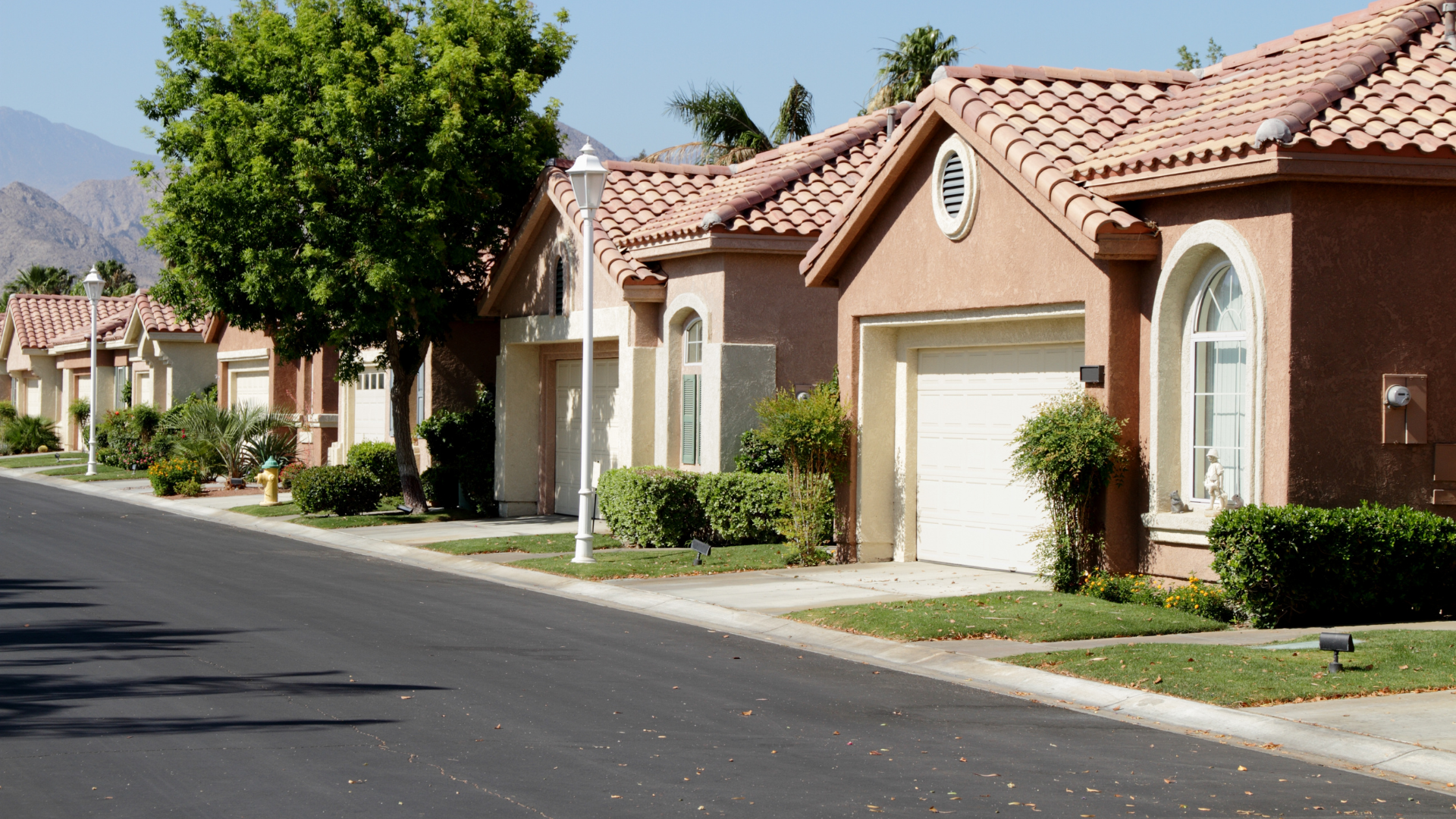 A row of houses on the side of a road