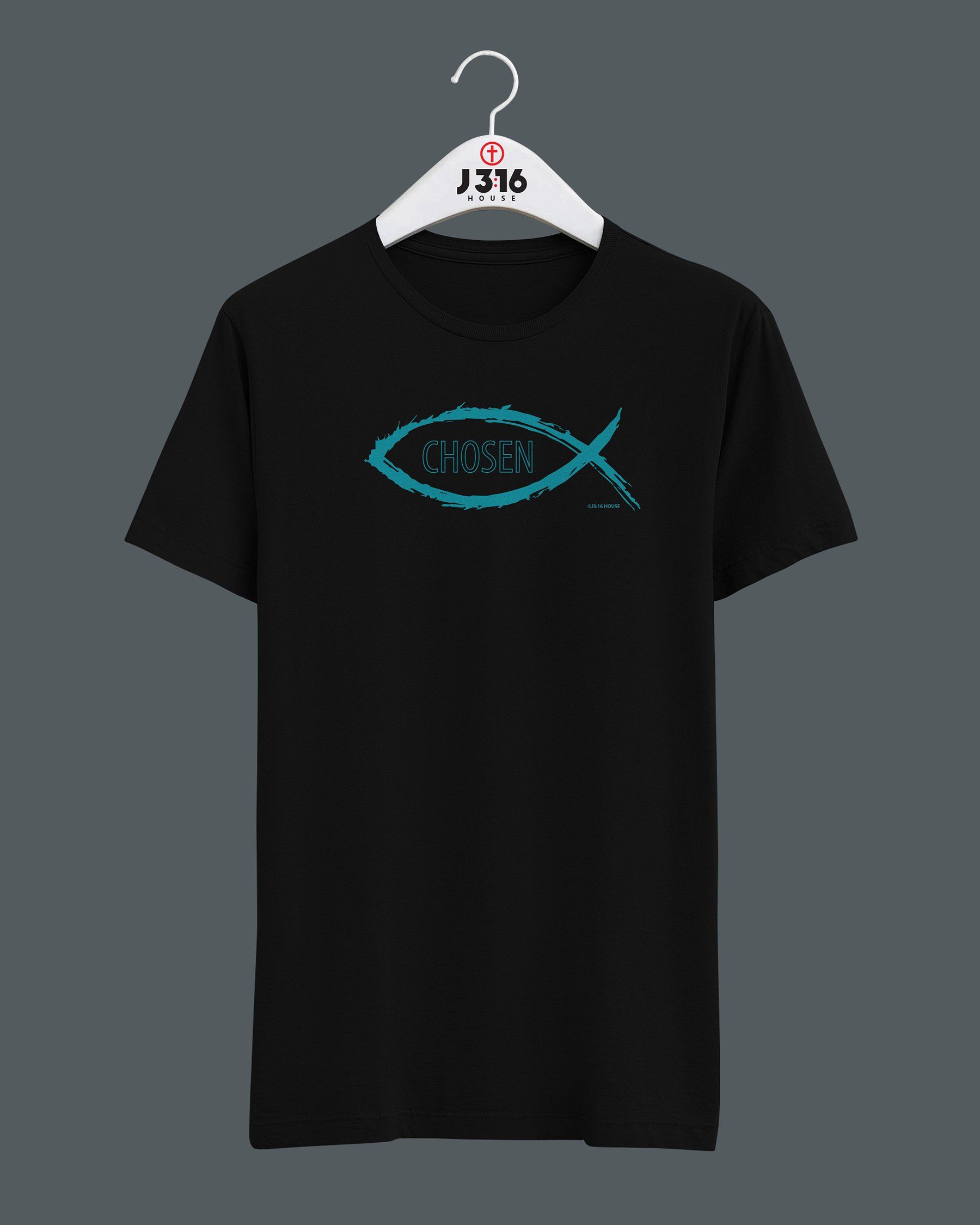 A black t-shirt with a fish on it is hanging on a hanger.