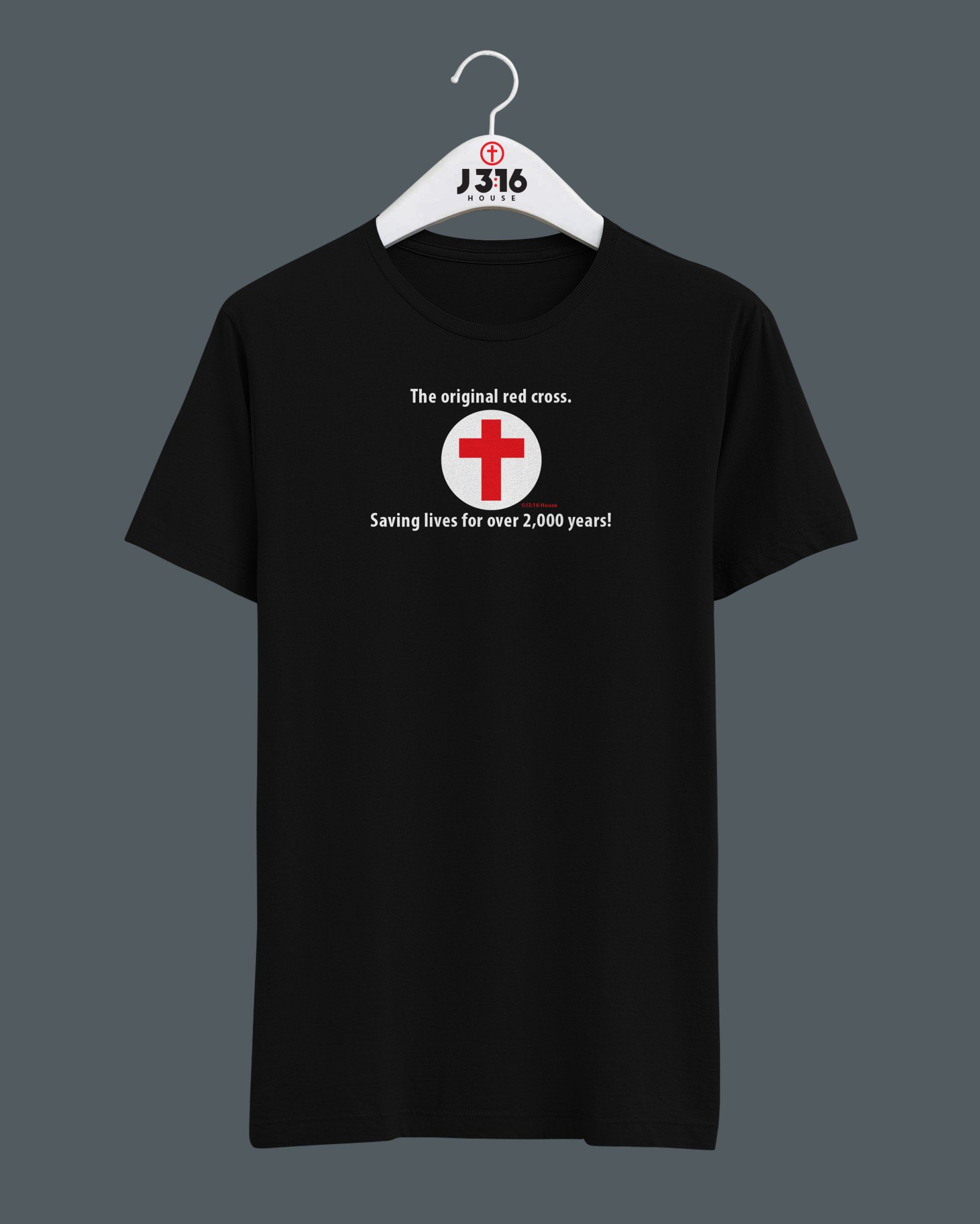 A black t-shirt with a red cross on it is hanging on a hanger.
