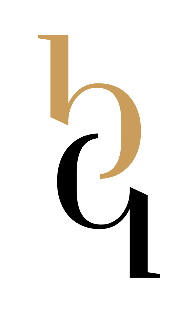 A black and gold logo with two letters on a white background.