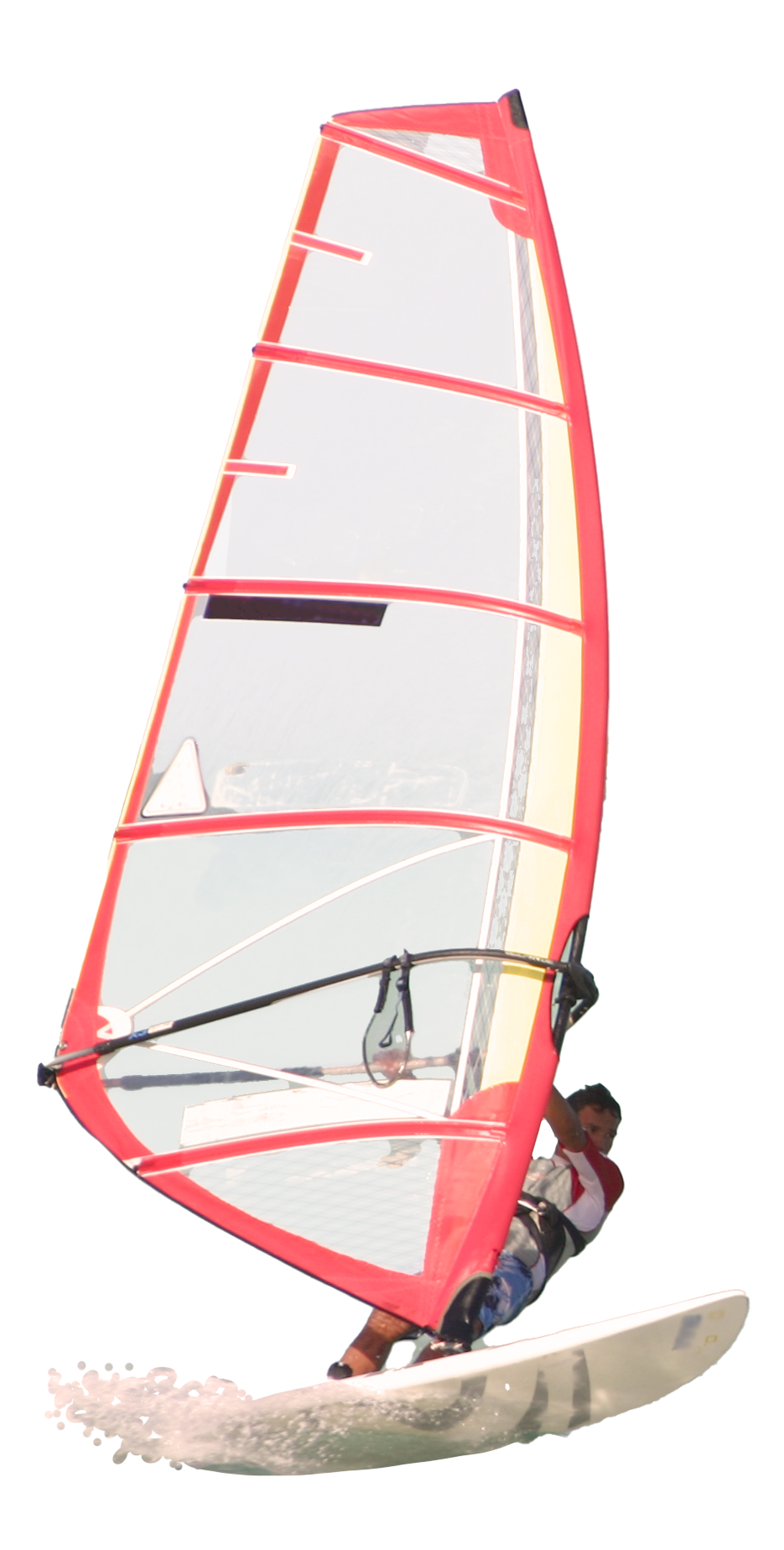 A person is riding a surfboard with a red sail.