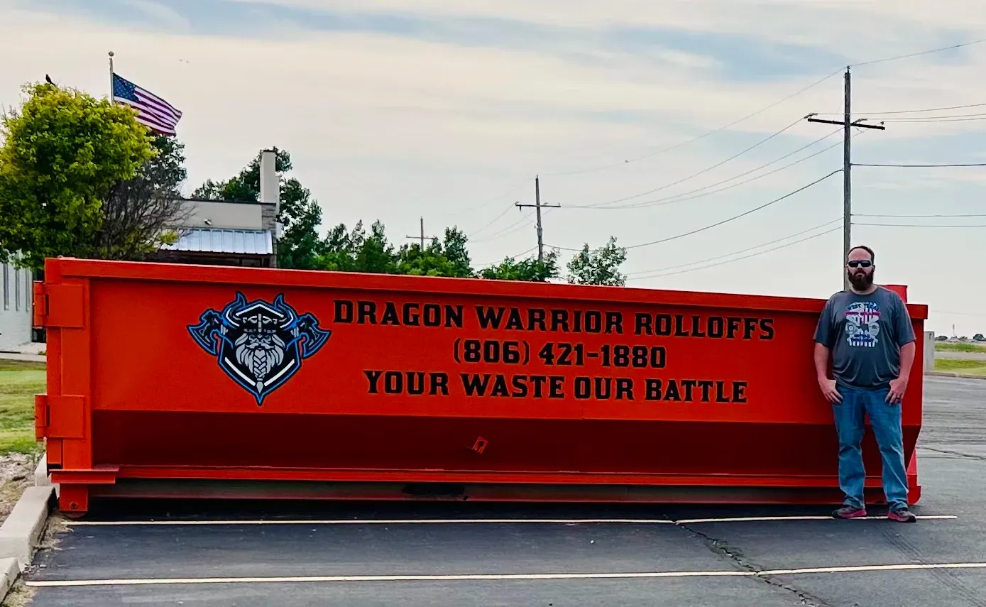 A dumpster with a phone number on it