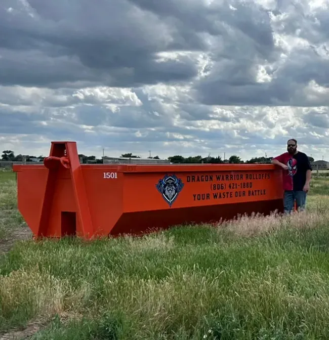 A dumpster with a phone number on it