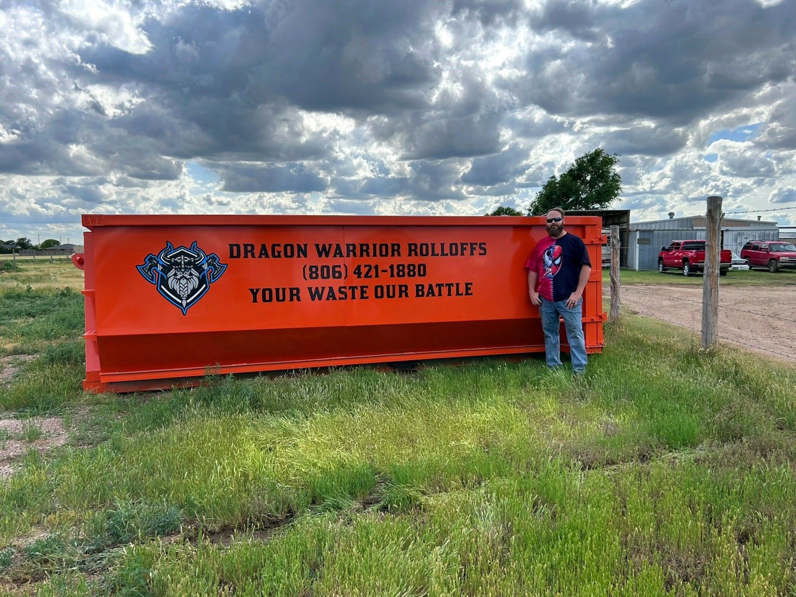 A dumpster with a phone number on it