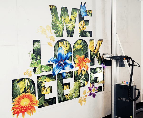 Wall Zen UV printing machine printing a colourful parrot mural directly onto a wall in Dubai