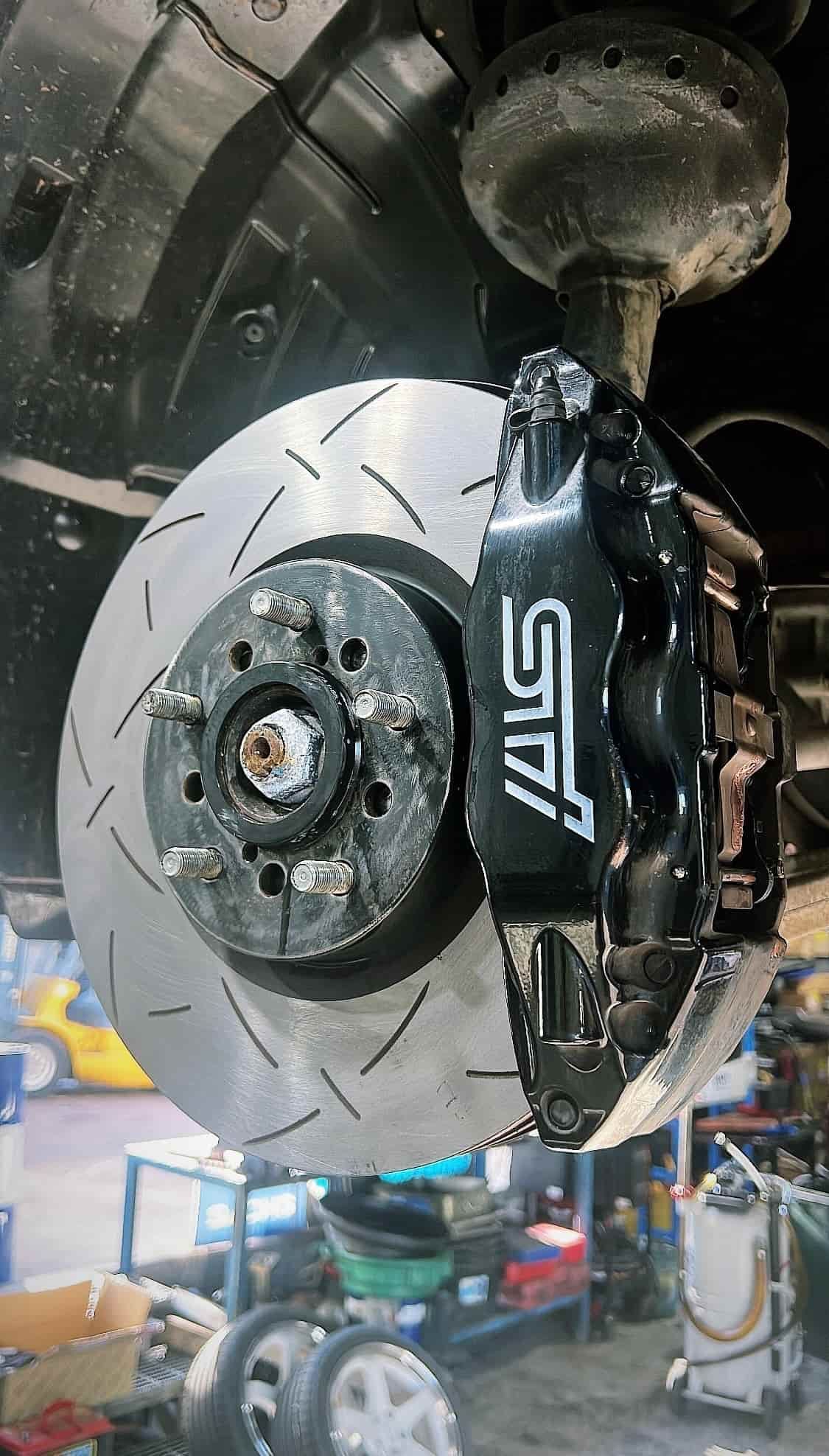 A Close Up of a Brake Disc on a Car in a Garage — AWS Mechanical in Stuart Park, NT