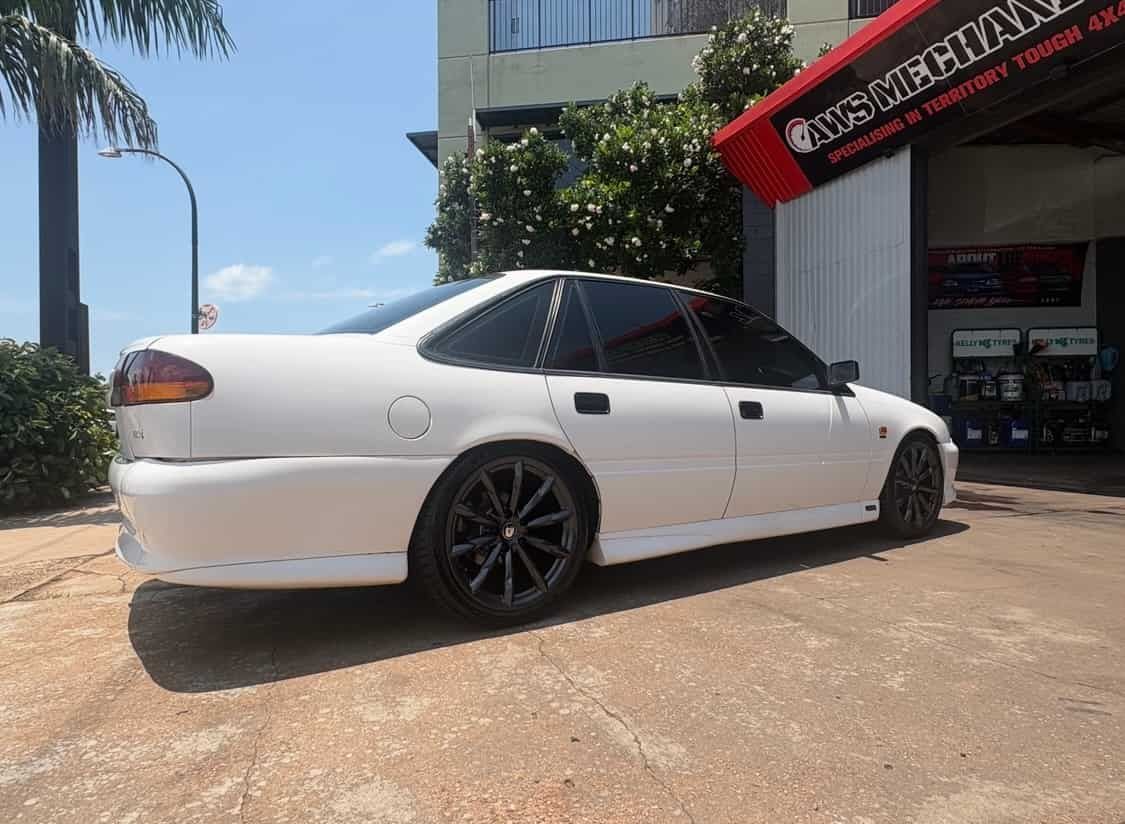 A White Car is Parked in Front of a Building — AWS Mechanical in Stuart Park, NT